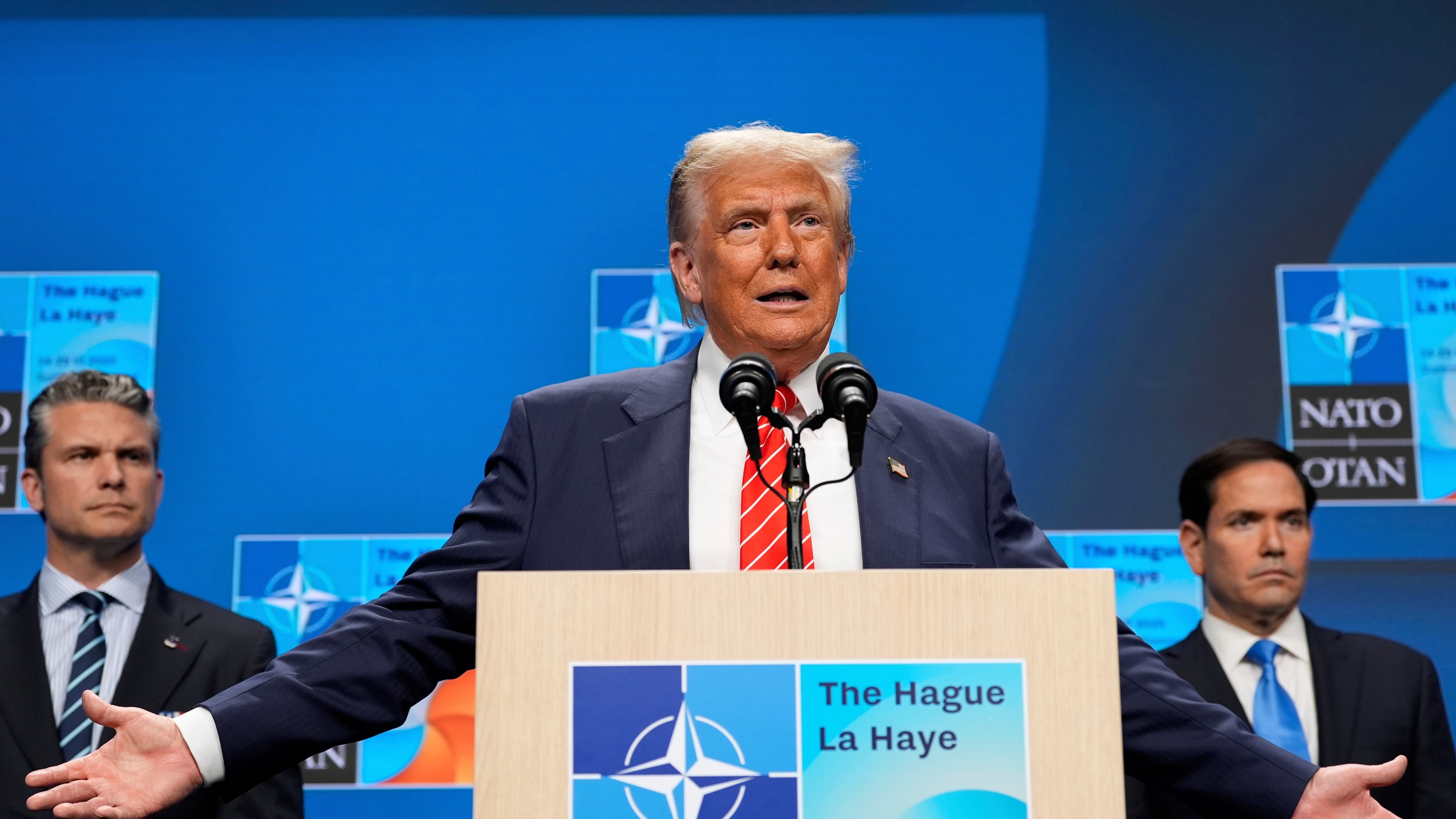 FILE - President Donald Trump speaks during a media conference at the end of the NATO summit as Secretary of State Marco Rubio, right, and Defense Secretary Pete Hegseth listen in The Hague, Netherlands, June 25, 2025. (AP Photo/Alex Brandon, File)
