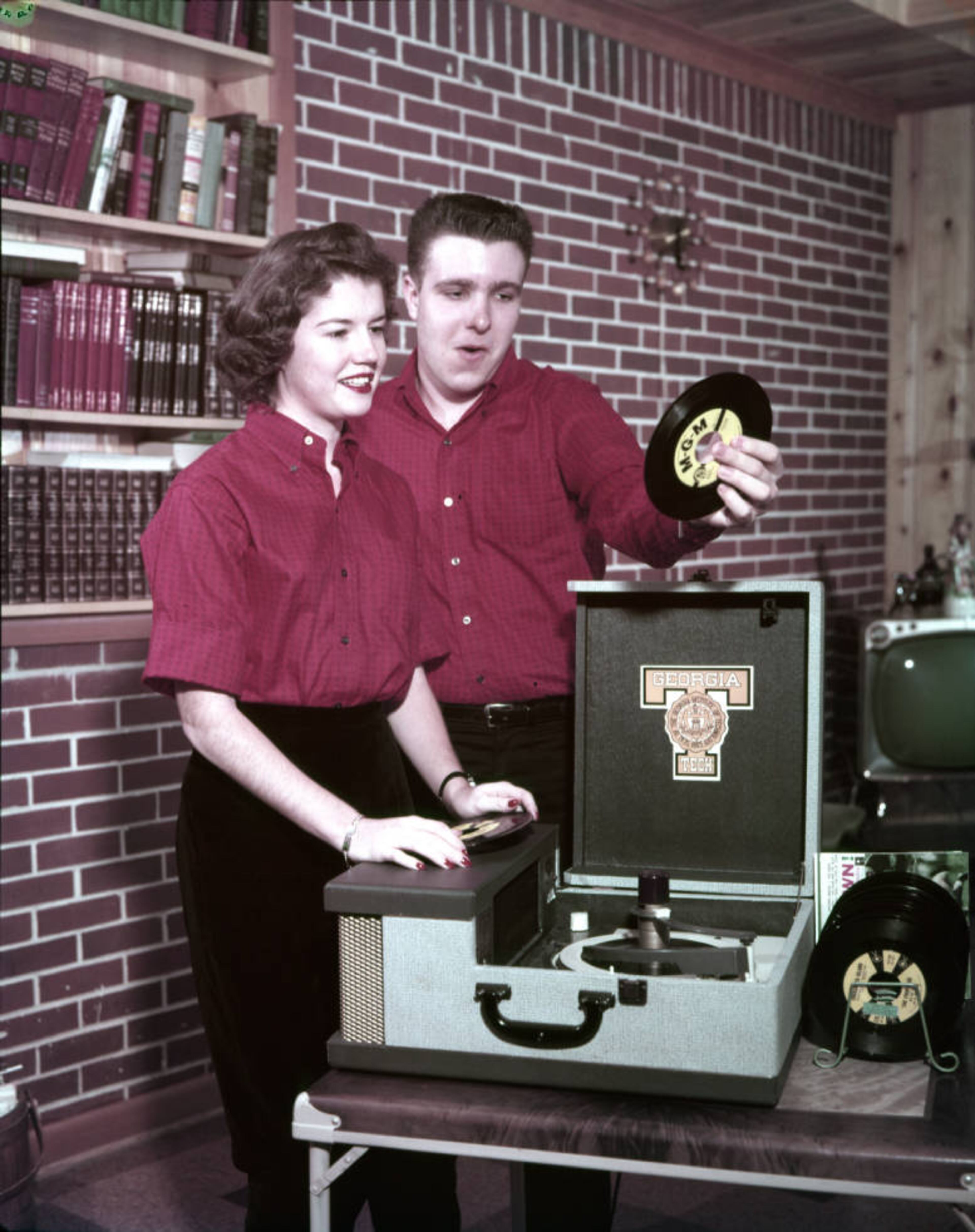 From the original caption info: "June Wells from Murphy and John Loundsbury of Southwest DeKalb are 'steadies' as any cat would know from looking at their matched outfits."