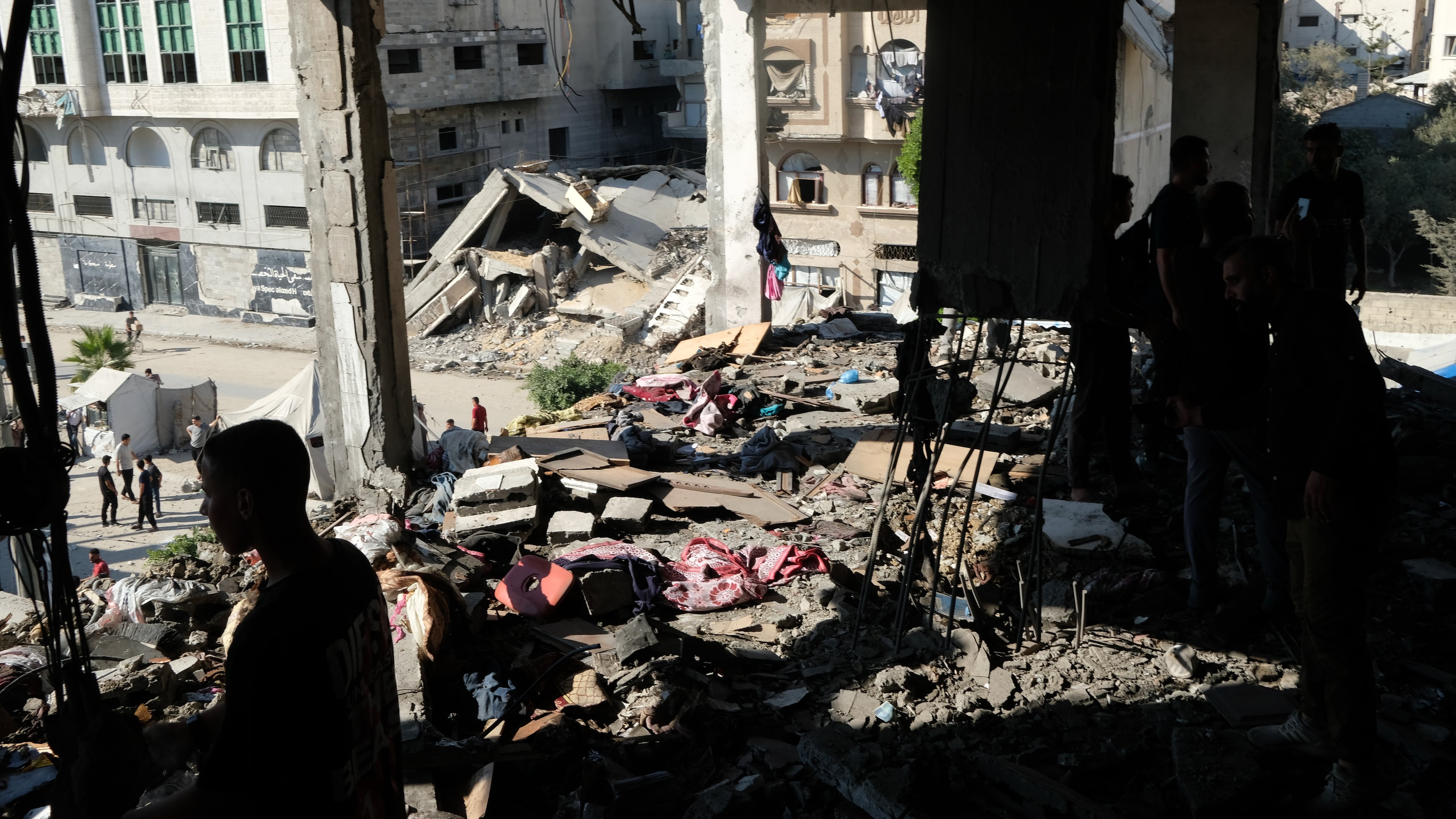 Residents inspect the site of an Israeli airstrike in Gaza city, Saturday, July 18, 2026. (AP Photo/Jehad Alshrafi)