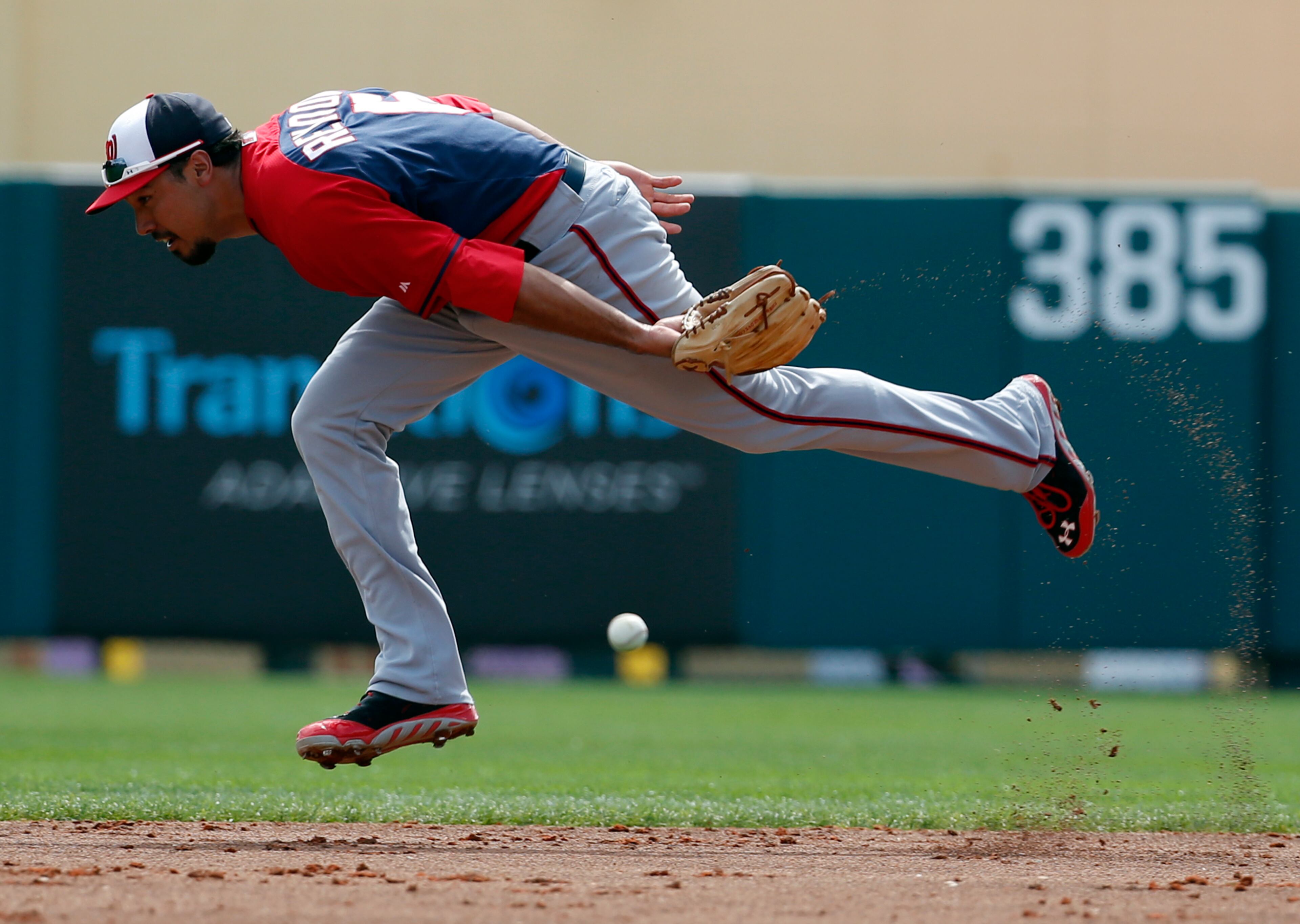 Washington Nationals second baseman Anthony Rendon (6) can't get the single hit by Atlanta Braves' Justin Upton in the second inning of a spring exhibition baseball game, Tuesday, March 4, 2014, in Kissimmee, Fla.