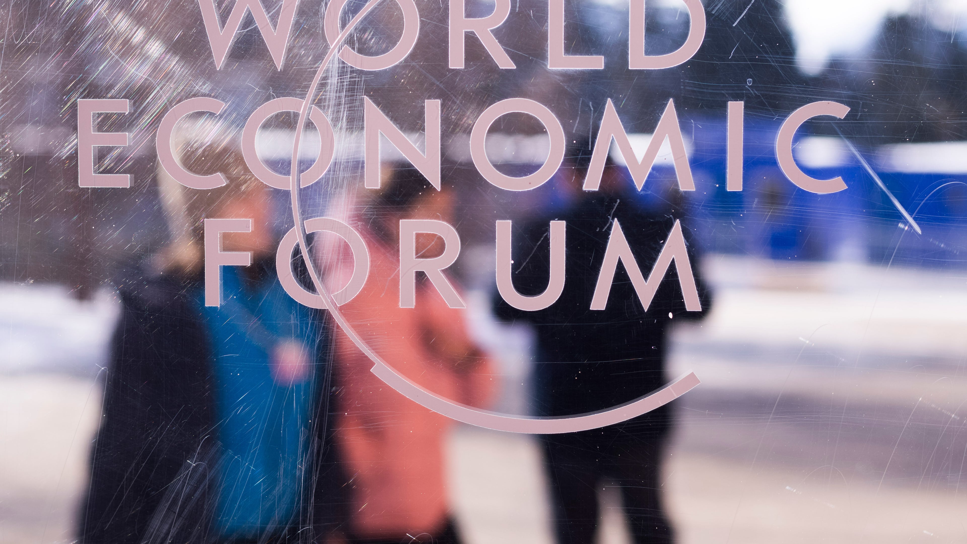 The logo of the World Economic Forum is displayed on a window of the Congress Center where the Annual Meeting Forum takes place in Davos, Switzerland, on Sunday, Jan. 18, 2026. (Markus Schreiber/AP)