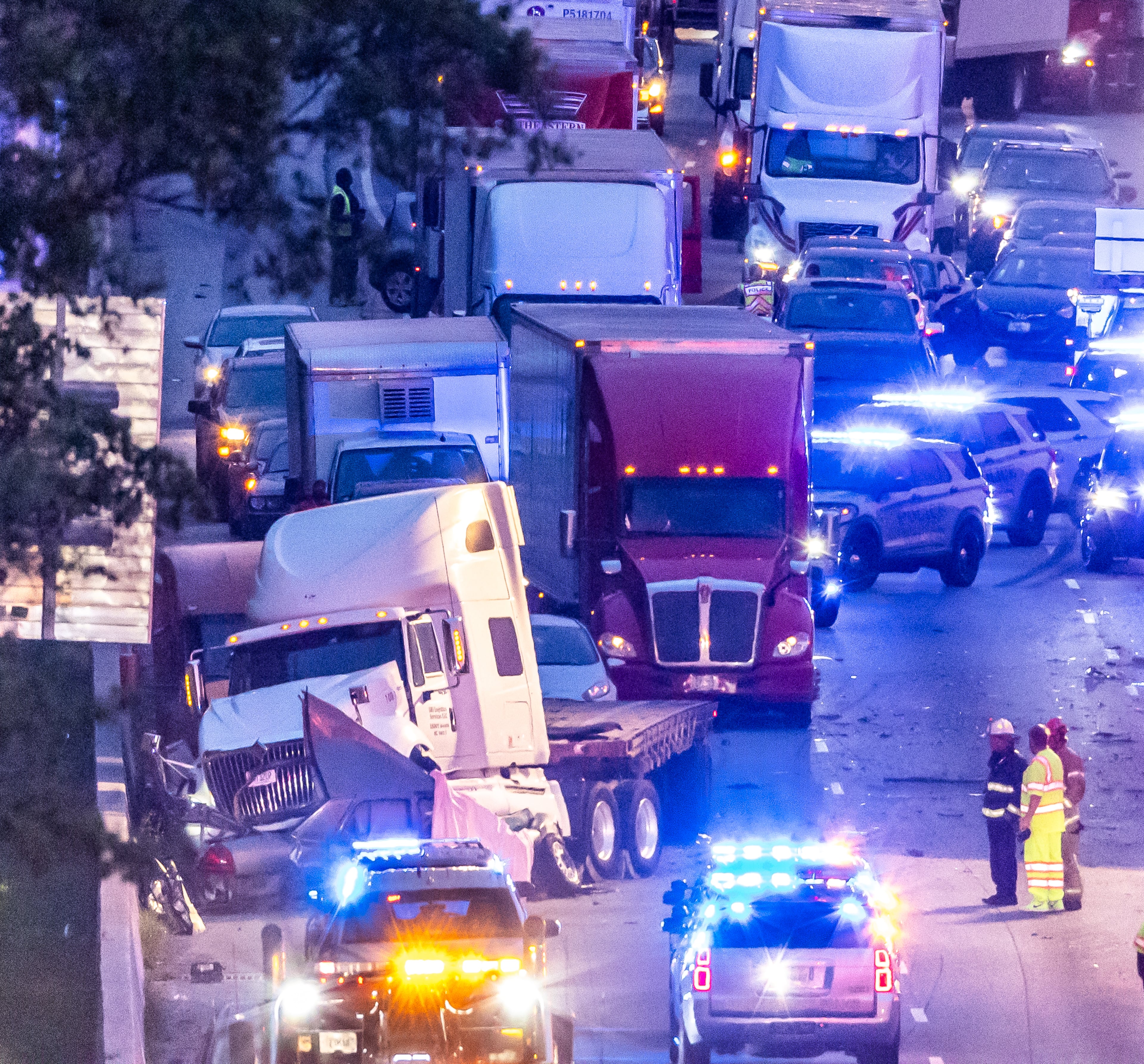 All lanes reopened on I-75 South in Henry County after a six hour investigation of a deadly crash involving multiple tractor-trailers that brought travel to a standstill Tuesday morning, April 16, 2024. The collision happened near mile marker 221, or just past Jodeco Road and before Jonesboro Road, at around 4:40 a.m., according to the Georgia Department of Transportation. The lanes were cleared by 11:20 a.m., GDOT stated, though traffic remains backed up for miles. Henry police confirmed at least one fatality. They did not release additional information about the extent of any other injuries. After the crash, a crane was used to lift a vehicle that appeared to have been pinned under one of the tractor-trailers. Several other big rigs remained on the shoulder of the interstate during the cleanup efforts. Police did not share details about what led to the wreck, as investigators processed the scene. Motorists were told to avoid the area. Backups extended for several miles, reaching I-675 as of 11:30 a.m. Commuters used U.S. 19/41, Ga. 42 and Ga. 155 as alternates, though traffic on those roads moved slowly, according to the WSB 24-hour Traffic Center. (Photo by John Spink/AJC)
