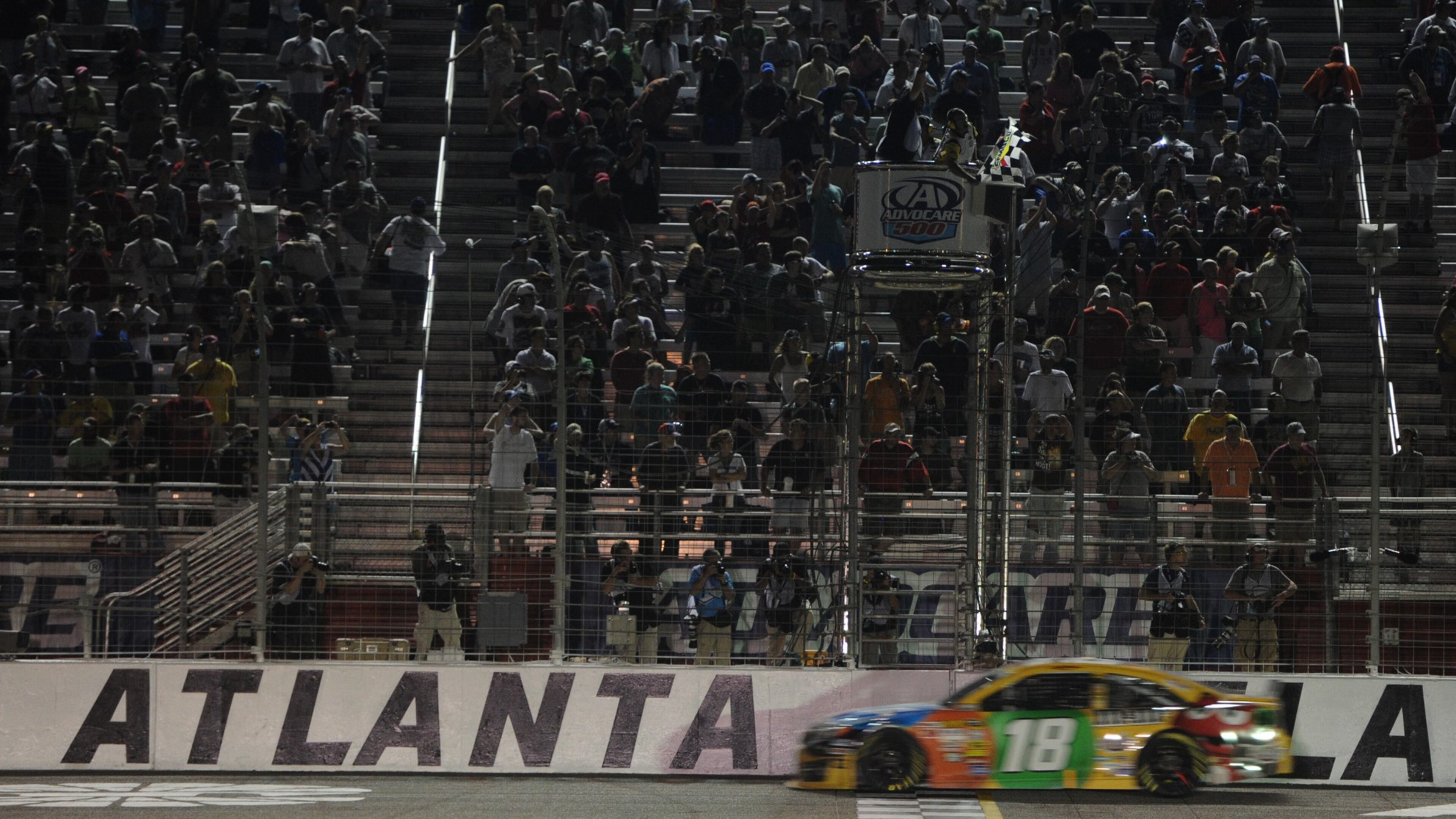 September 1, 2013 - Hampton: Kyle Busch crosses the finish line to win the Advocare 500 at Atlanta Motor Speedway on Sunday, September 1, 2013. JOHNNY CRAWFORD / JCRAWFORD@AJC.COM