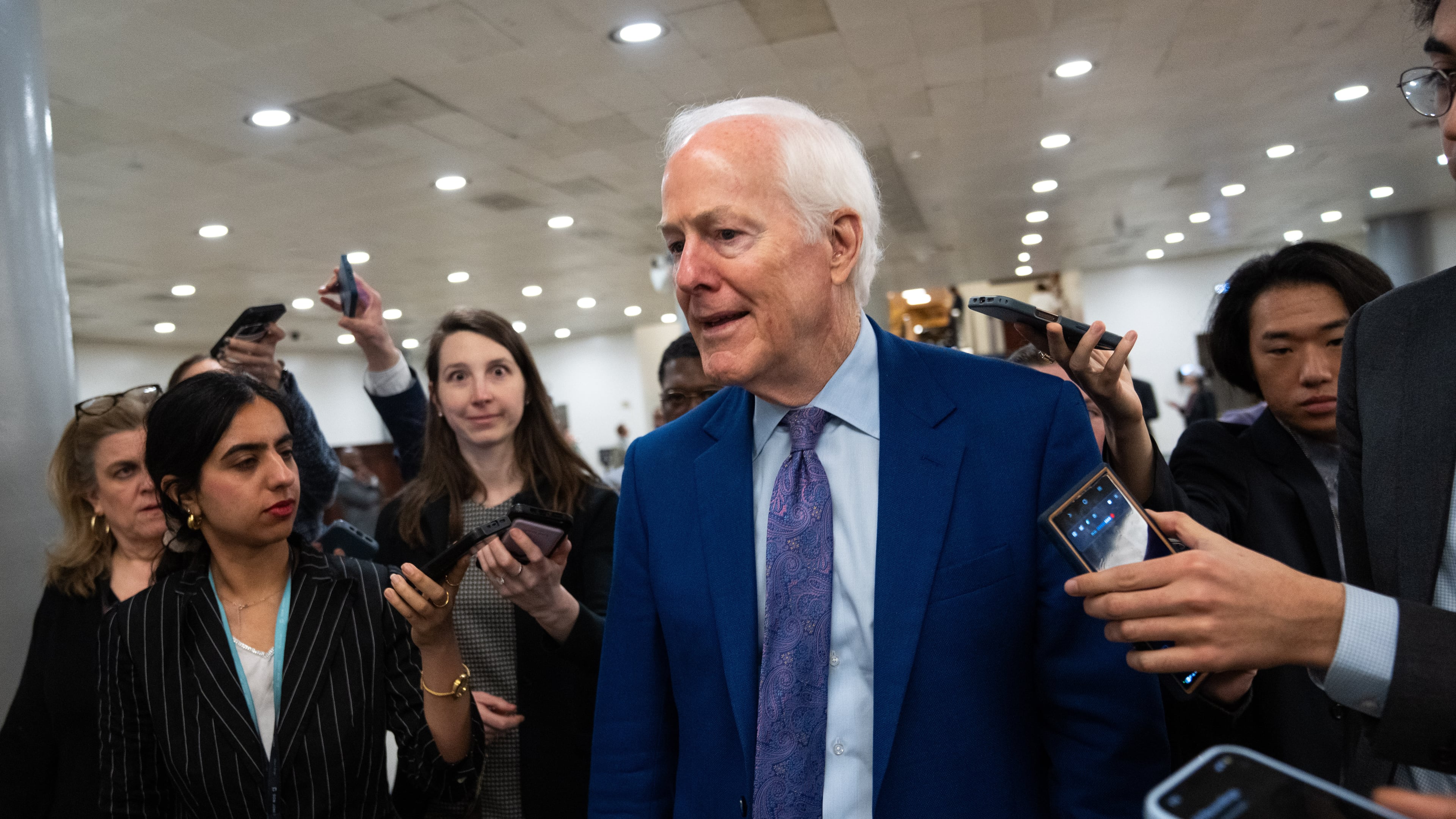 Sen. John Cornyn, R-Texas, departs following votes at the Capitol, Thursday, March 5, 2026, in Washington. (AP Photo/Allison Robbert)