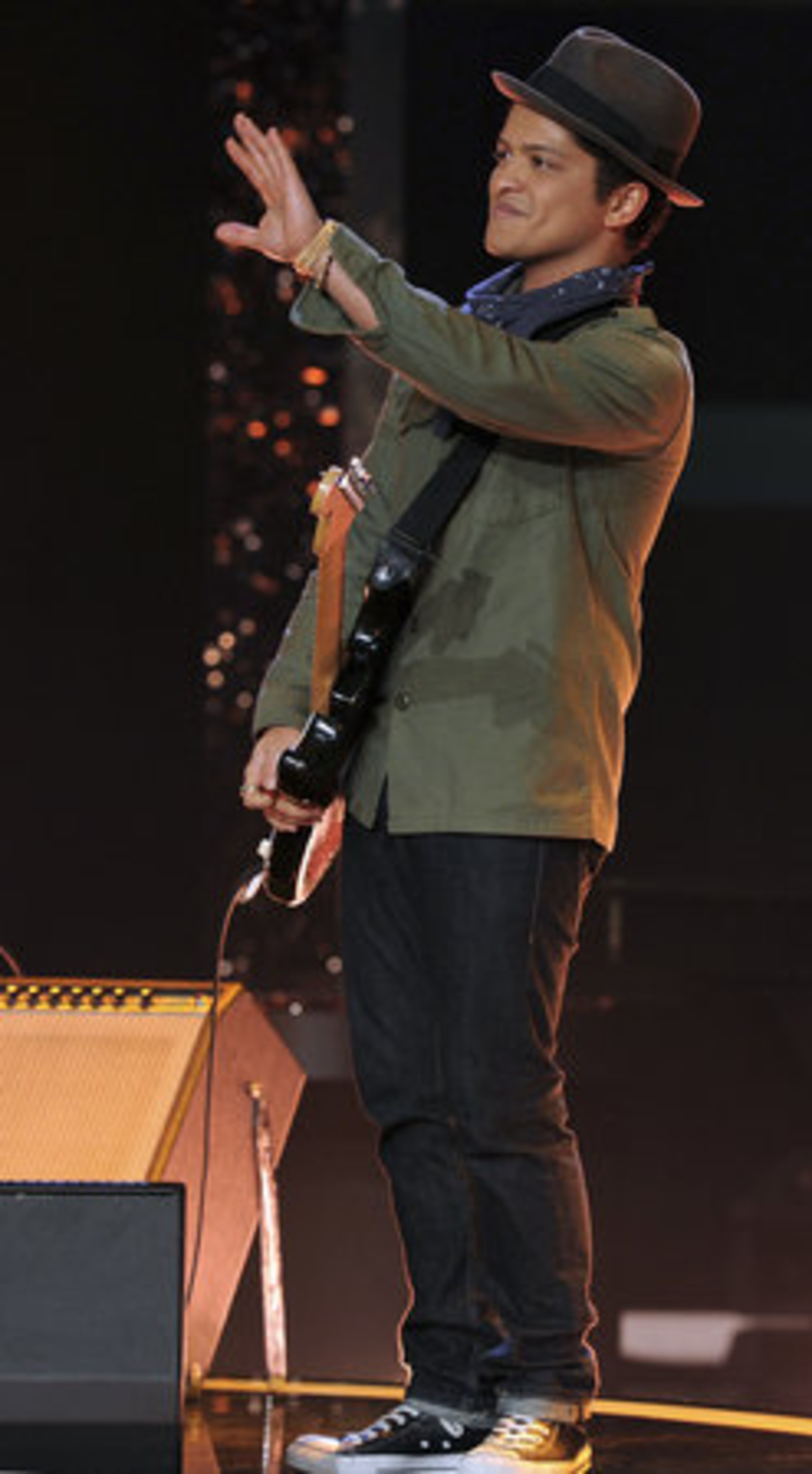 Singer Bruno Mars waves to the crowd as he performs during the German TV show "Wetten Dass...?" (Bet it...?)