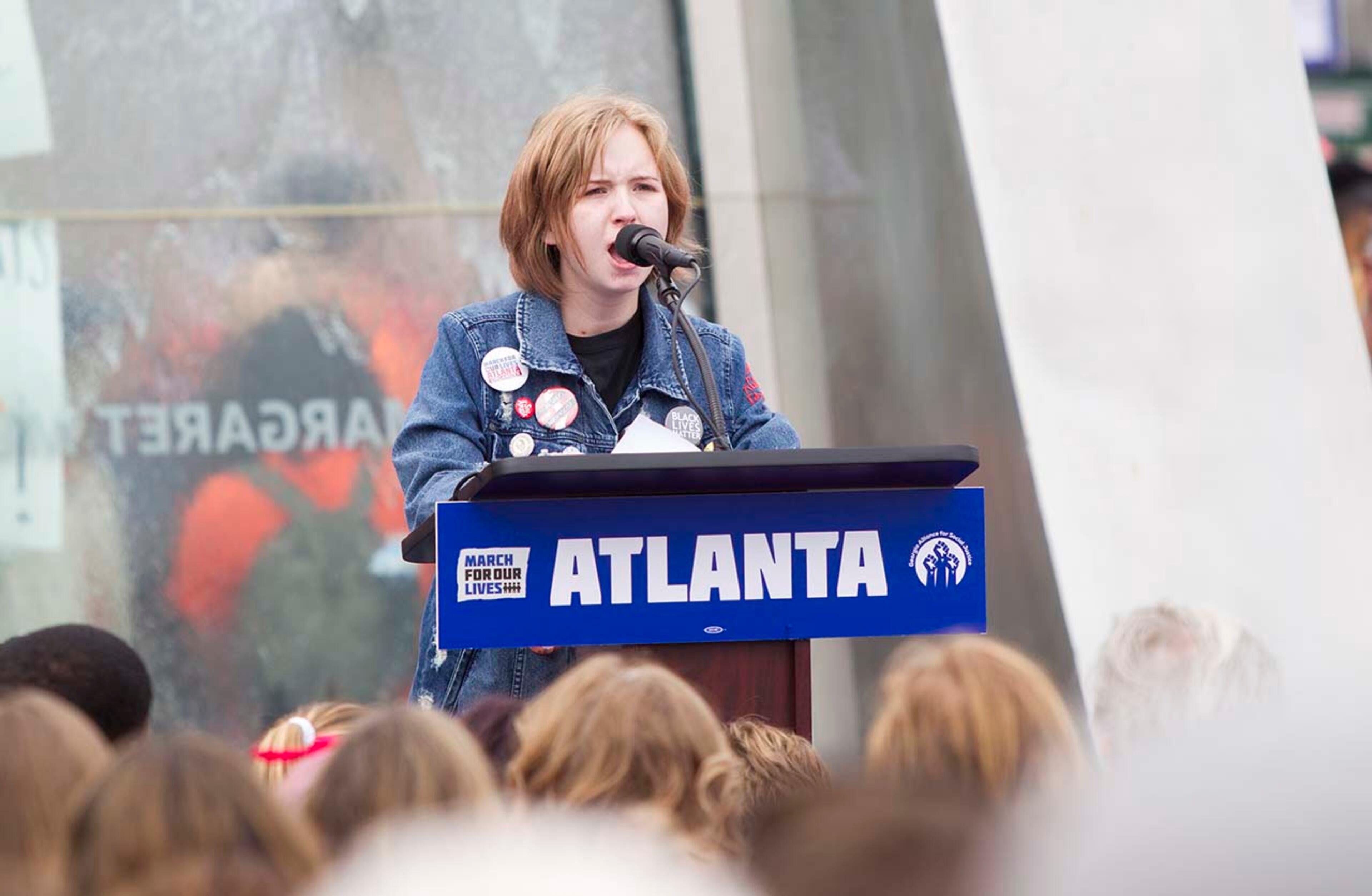 Savannah Nemeth, a student at Collins Hill High, recites a poem she wrote after the Parkland shooting during the March for our Lives event in Atlanta, Georgia, on Saturday, March 24, 2018. (REANN HUBER/REANN.HUBER@AJC.COM)
