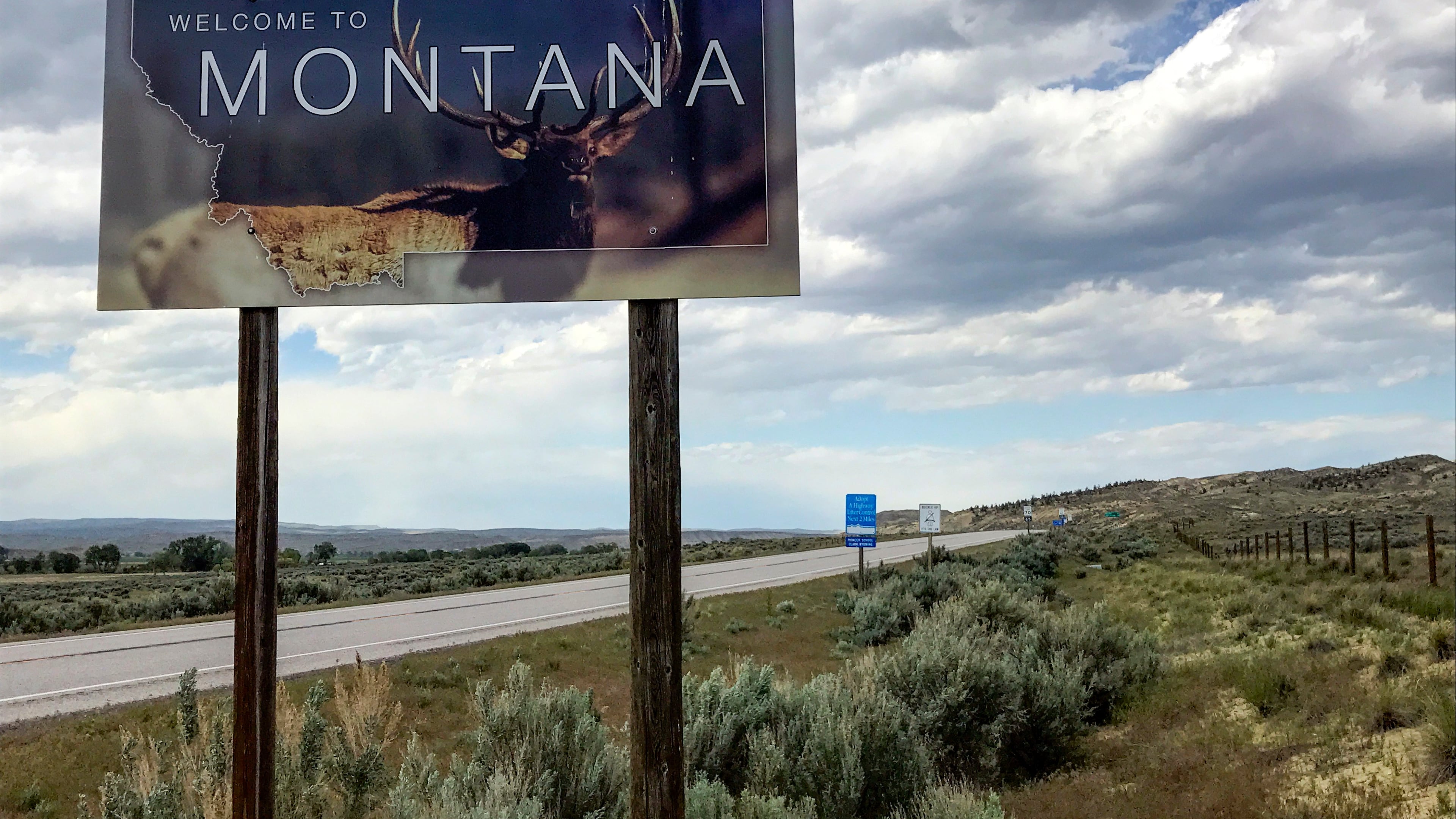 FILE - A "Welcome to Montana" sign is seen along Montana State Highway 72 near Chance, Mont., May 24, 2017. (AP Photo/Robert Yoon, File)
