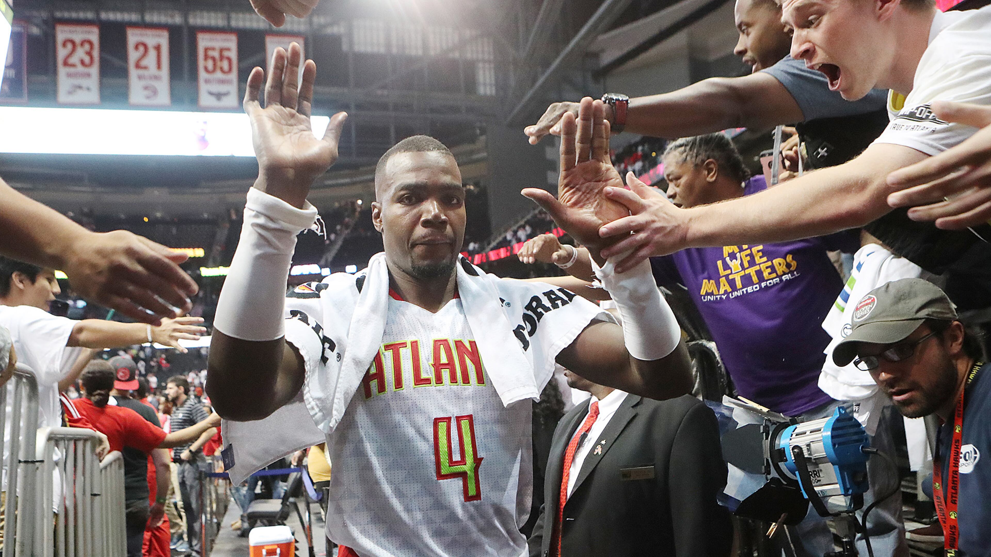 October 27, 2016 ATLANTA: Hawks Paul Millsap gets high fives from fans after beating the Wizards 114-99 in the home opener of their NBA basketball game at Philips Arena on Thursday, Oct. 27, 2016, in Atlanta. Curtis Compton /ccompton@ajc.com