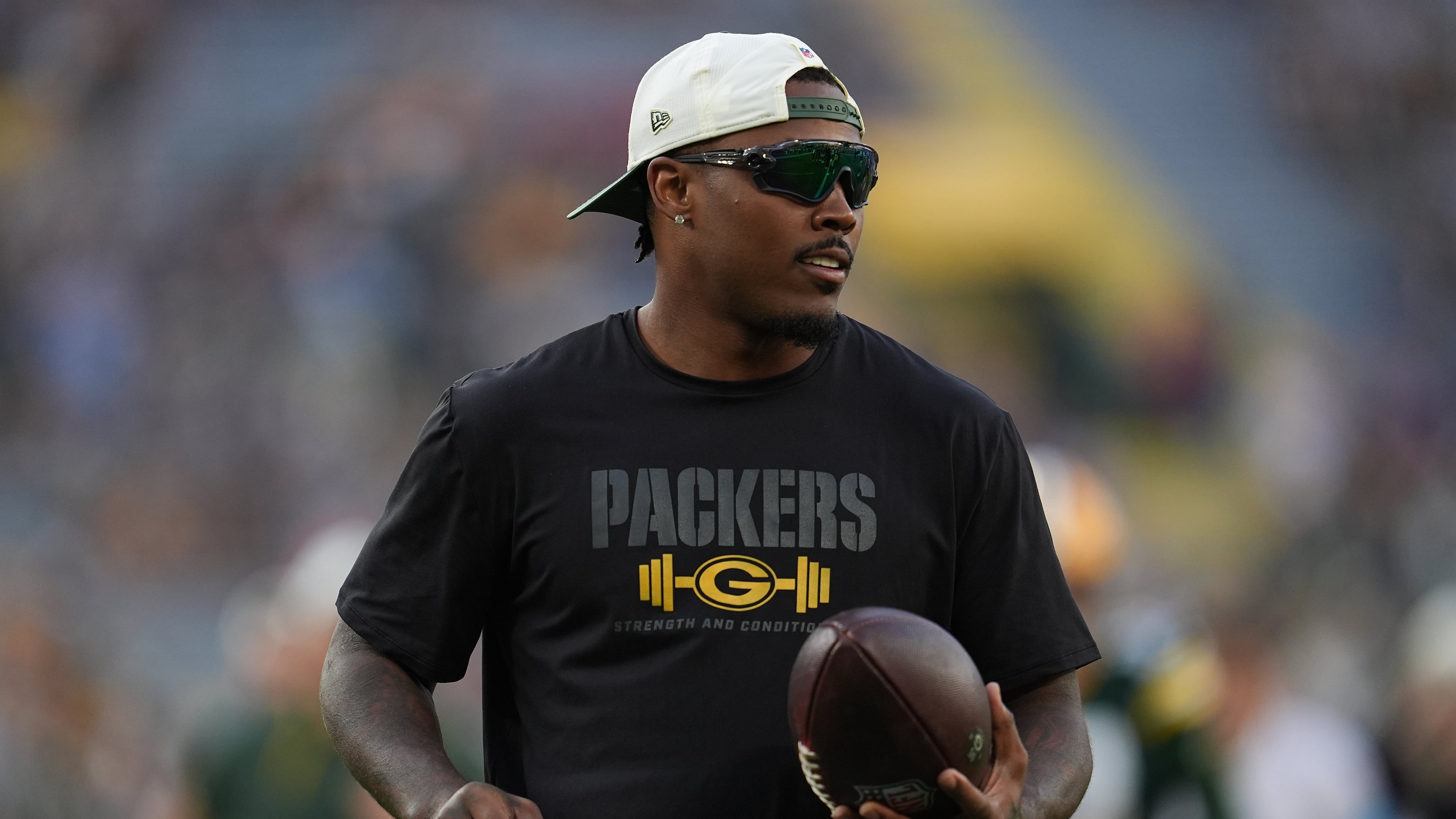 FILE - Green Bay Packers running back Josh Jacobs stands on the field before a NFL preseason football game against the Arizona Cardinals, Aug. 28, 2026, in Green Bay, Wis. (AP Photo/Abbie Parr, File)