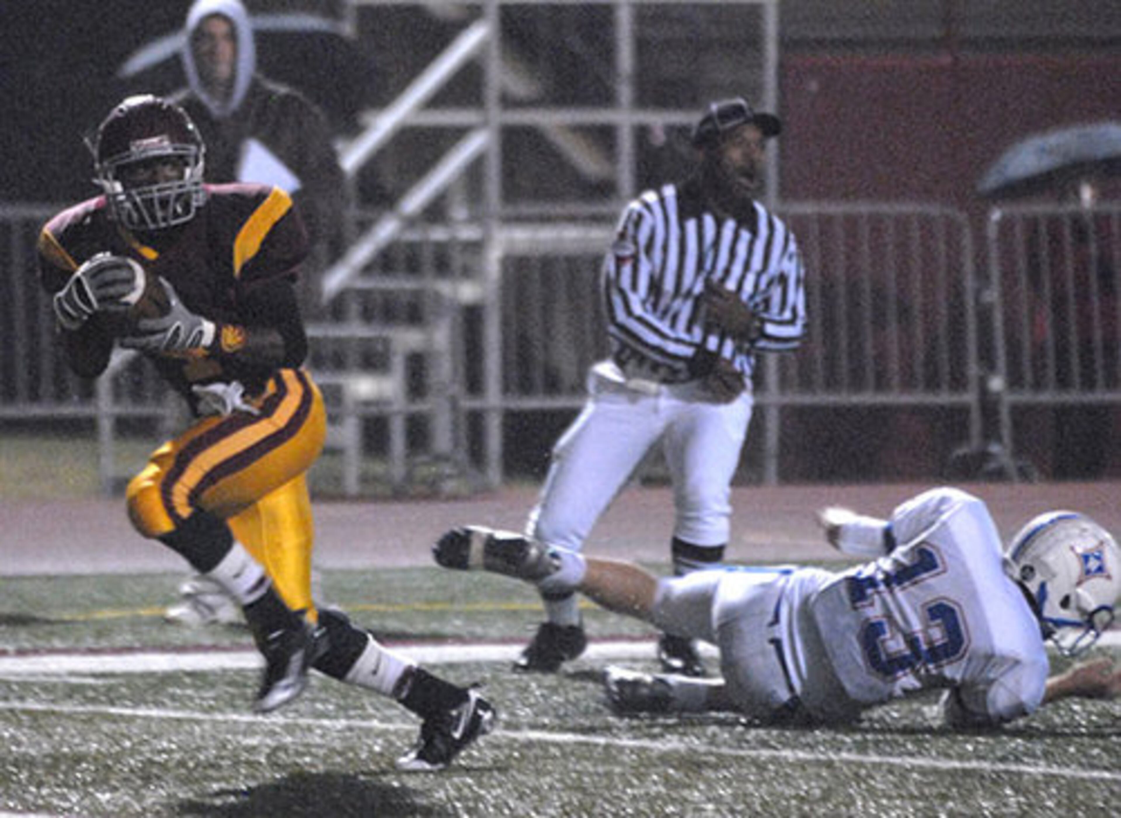Lassiter's Xavier Morgan (No. 4) rushes for what would have been a first-quarter touchdown. The play was called back on a penalty.