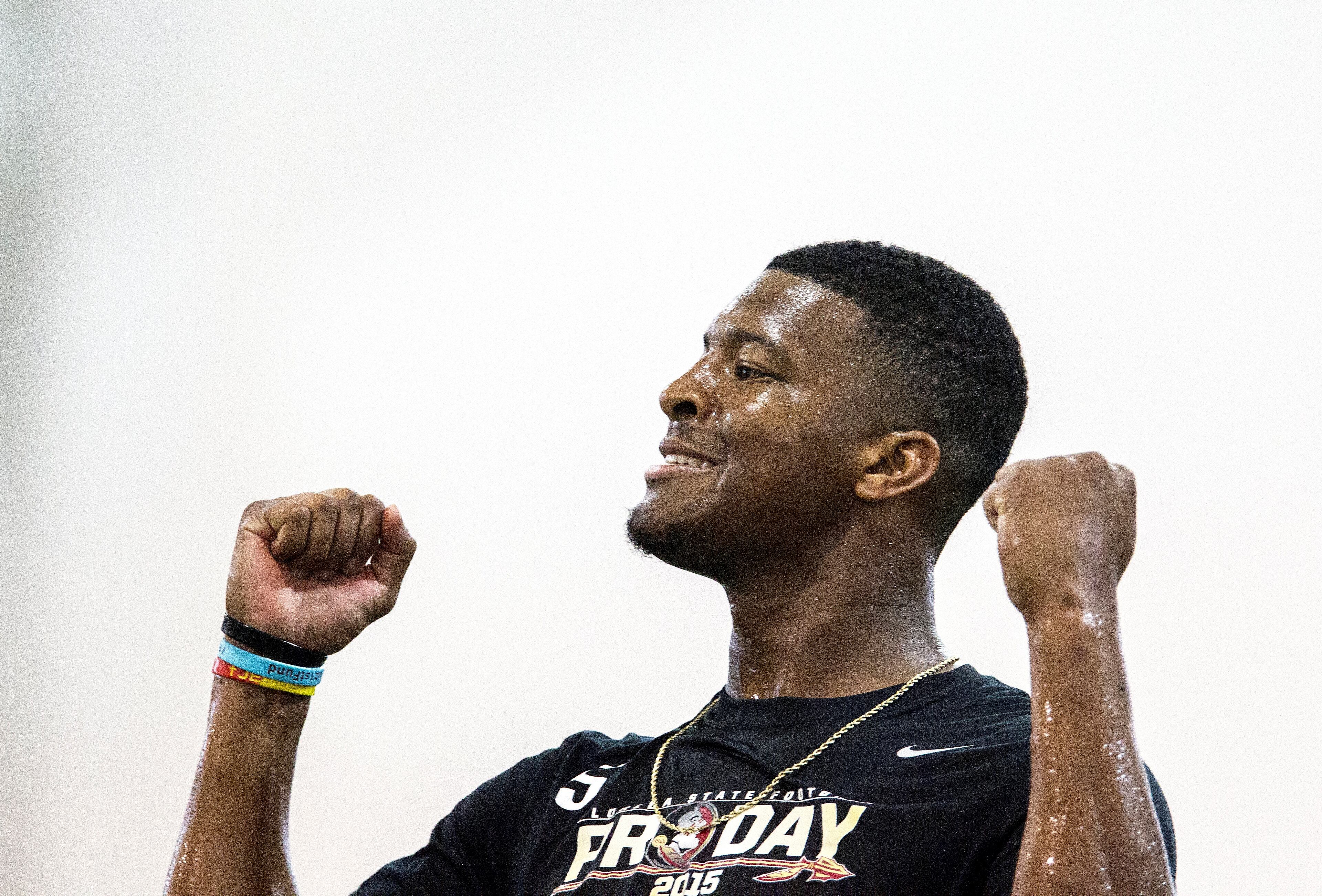 Jameis Winston pumps his fists after a pass competition during Florida State football pro day in Tallahassee, Fla., Tuesday, March 31, 2015.