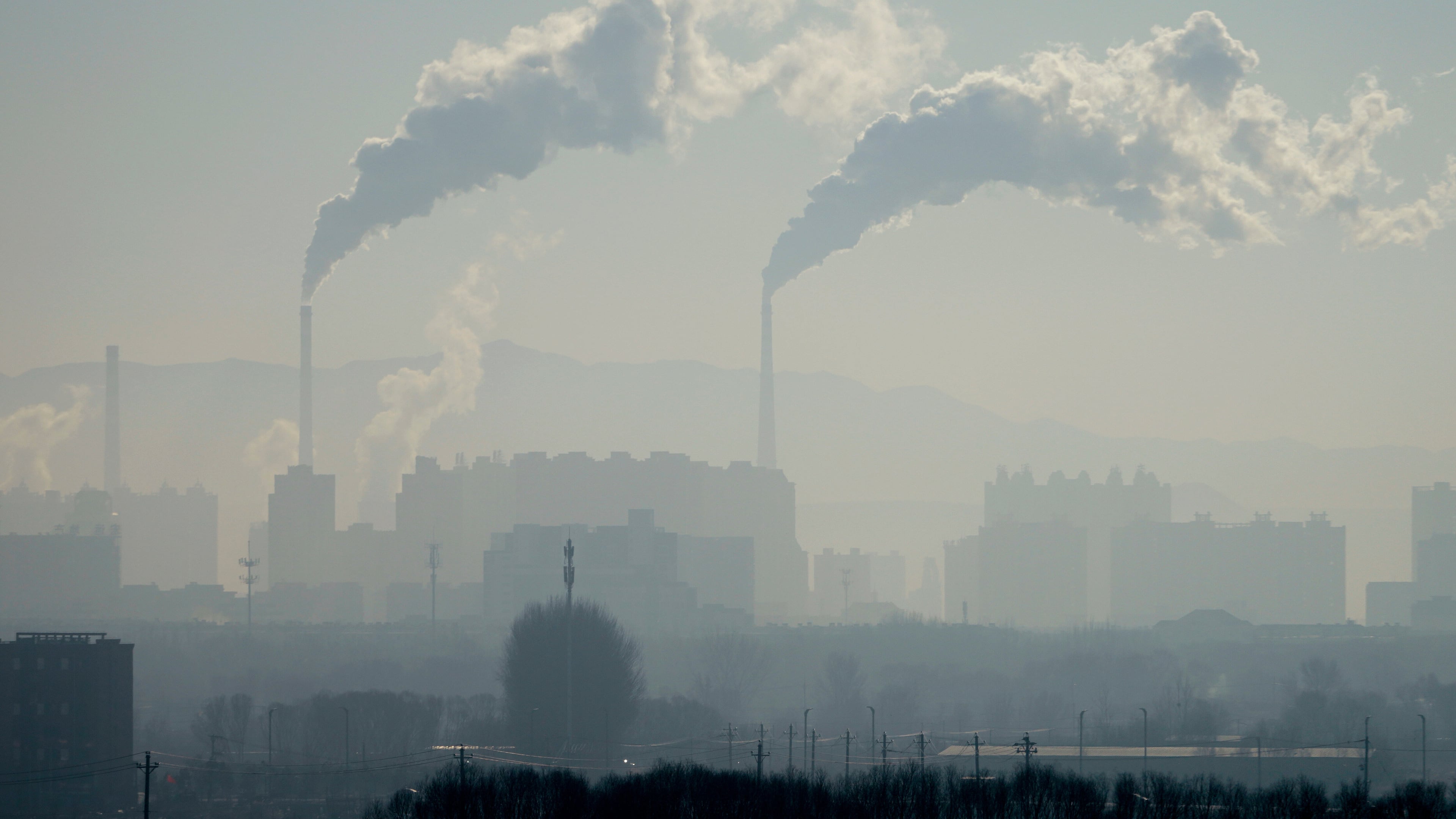 A power plant is seen from a train from Beijing to Shenyang in northwestern China on Jan. 3, 2026. (AP Photo/Ng Han Guan)
