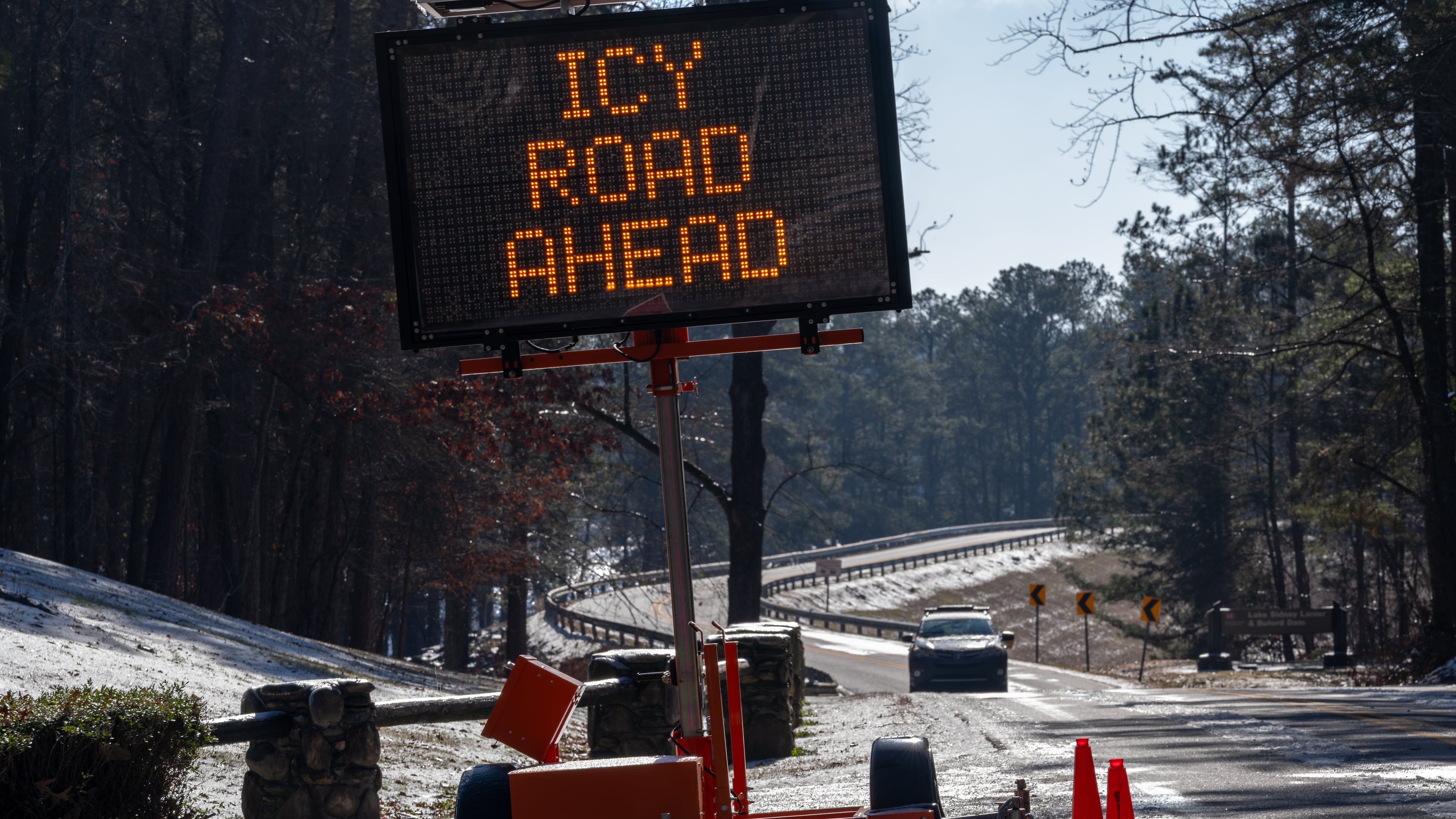 A sign warns travelers of icy roads on Buford Dam Road in Cumming on Monday, Jan. 26, 2026. Temperatures will remain frigid to start Tuesday. (Ben Hendren for the AJC)