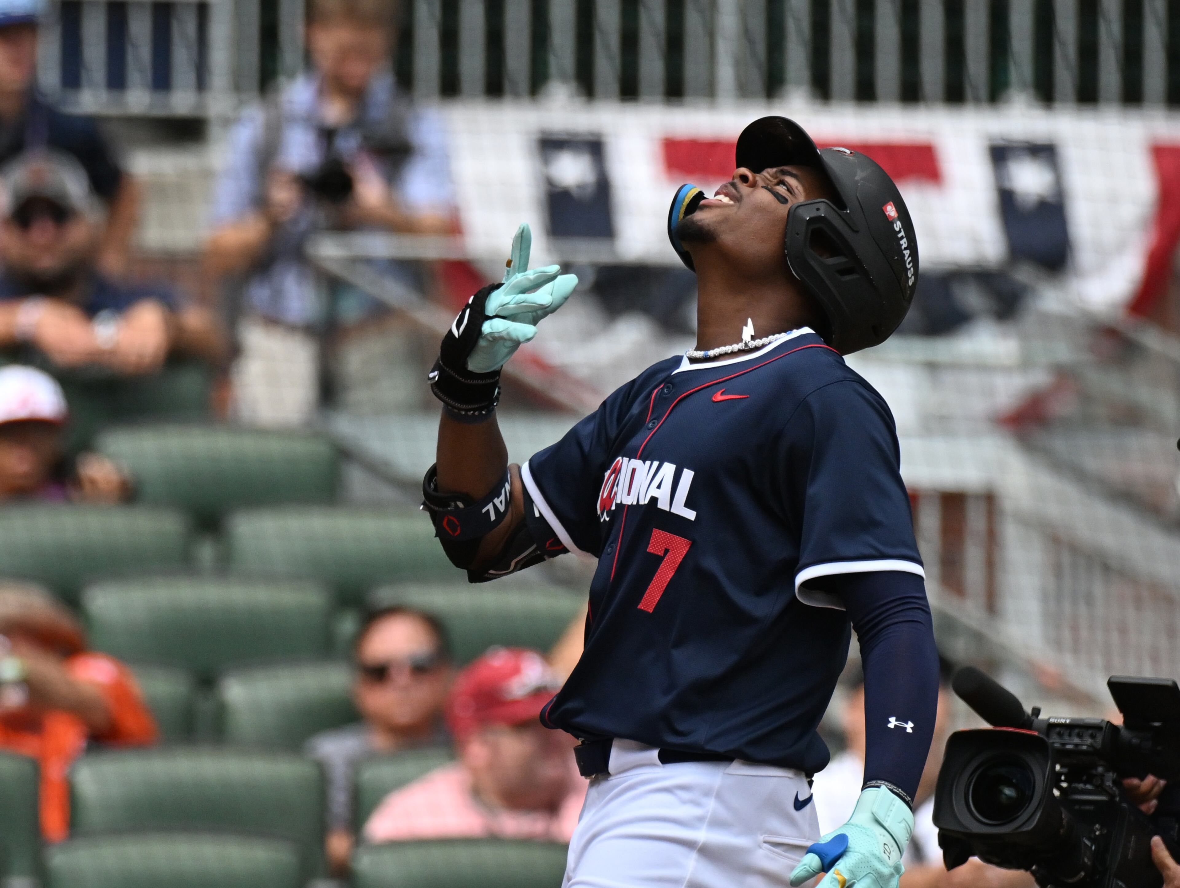 National League outfielder Josue De Paula (7) celebrates after hitting a 3-run home run during the fourth inning of the All-Star Futures Game at Truist Park, Saturday, July 12, 2025, in Atlanta. National League won 4-2 over American League. (Hyosub Shin / AJC)