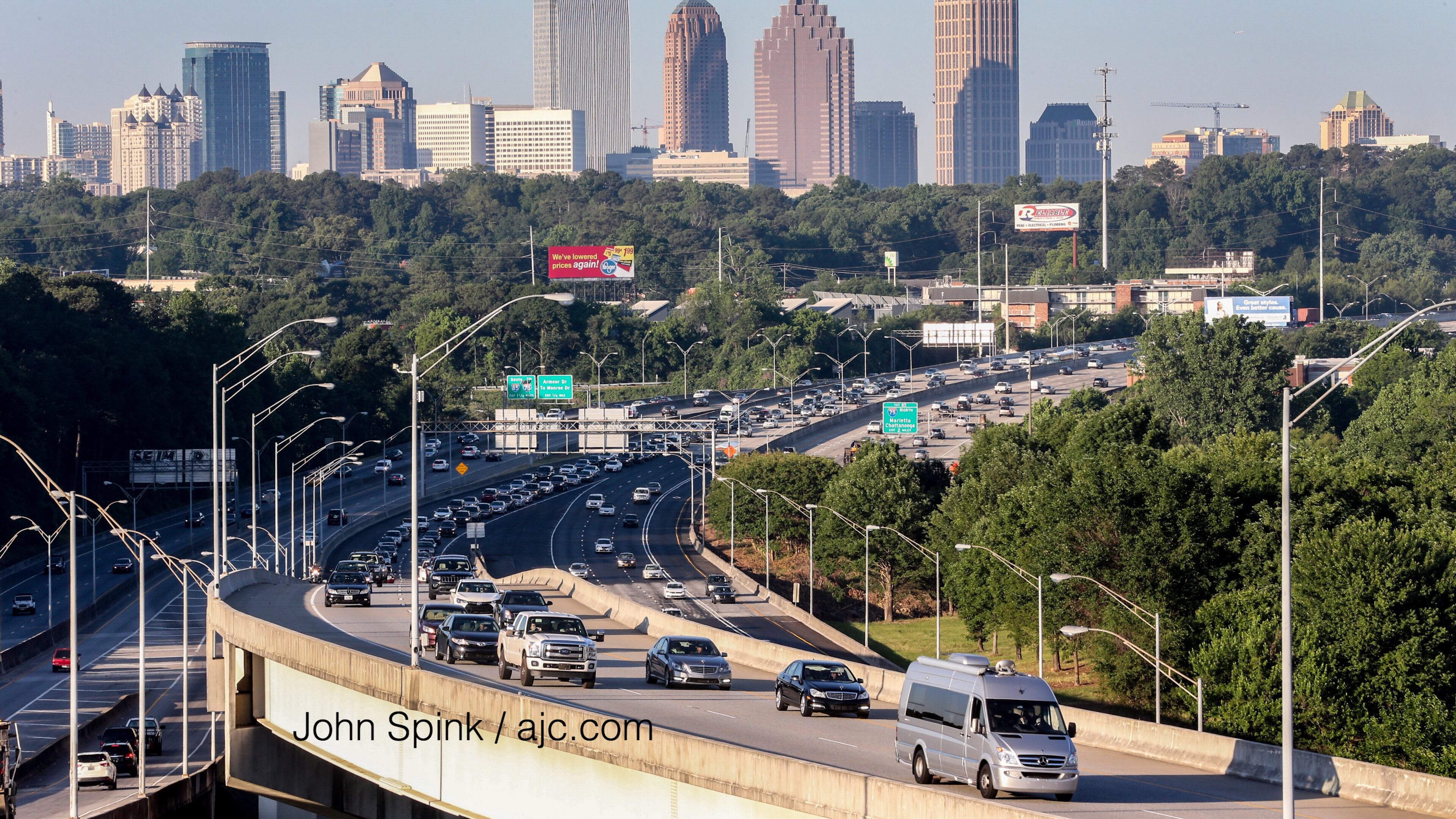 Traffic builds on the first Monday morning commute since the I-85 reopening. JOHN SPINK / JSPINK@AJC.COM