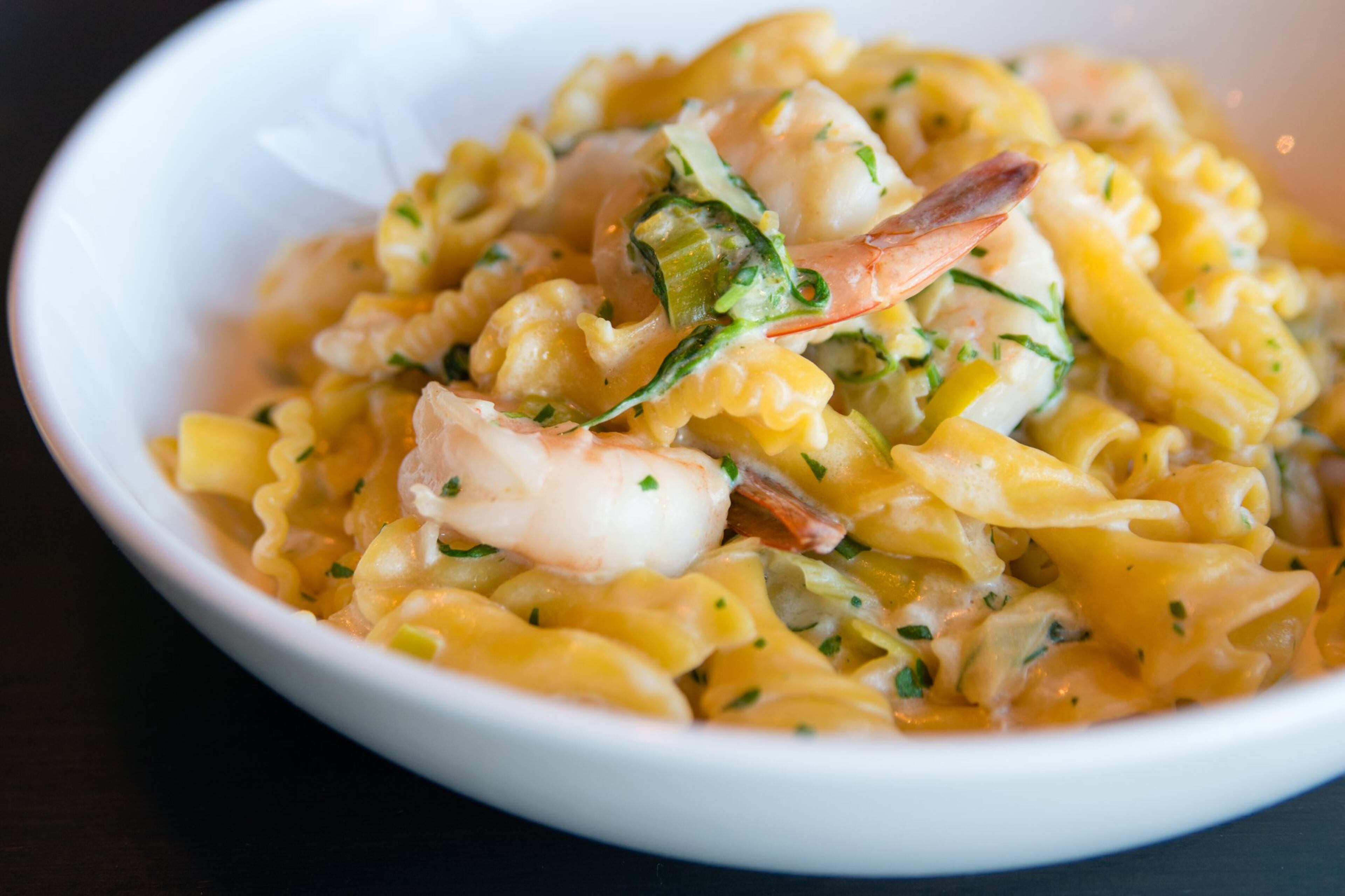 From the pasta menu at Allora, the lemon saffron campanelle is tossed with local shrimp, leeks, tarragon, preserved lemon and butter sauce. CONTRIBUTED BY HENRI HOLLIS
