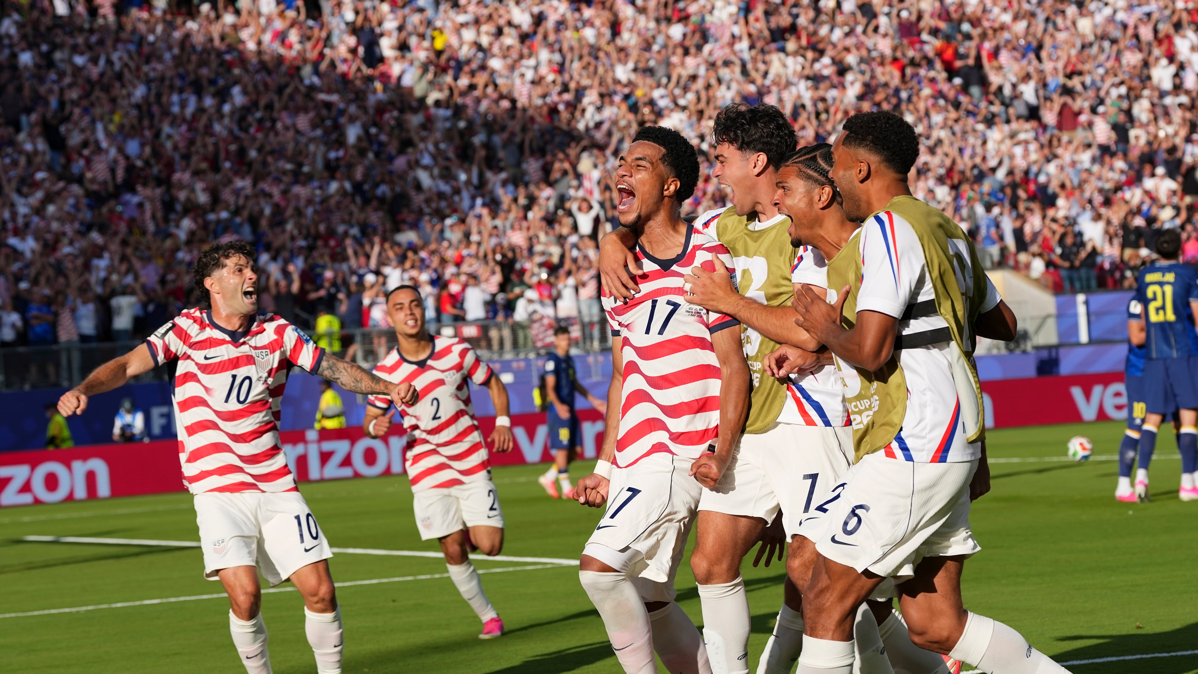 United States' Malik Tillman (17) celebrates with teammates after scoring on a free kick during the World Cup round of 32 soccer match between the United States and Bosnia in Santa Clara, Calif., near San Francisco, Wednesday, July 1, 2026. (AP Photo/Martin Meissner)
