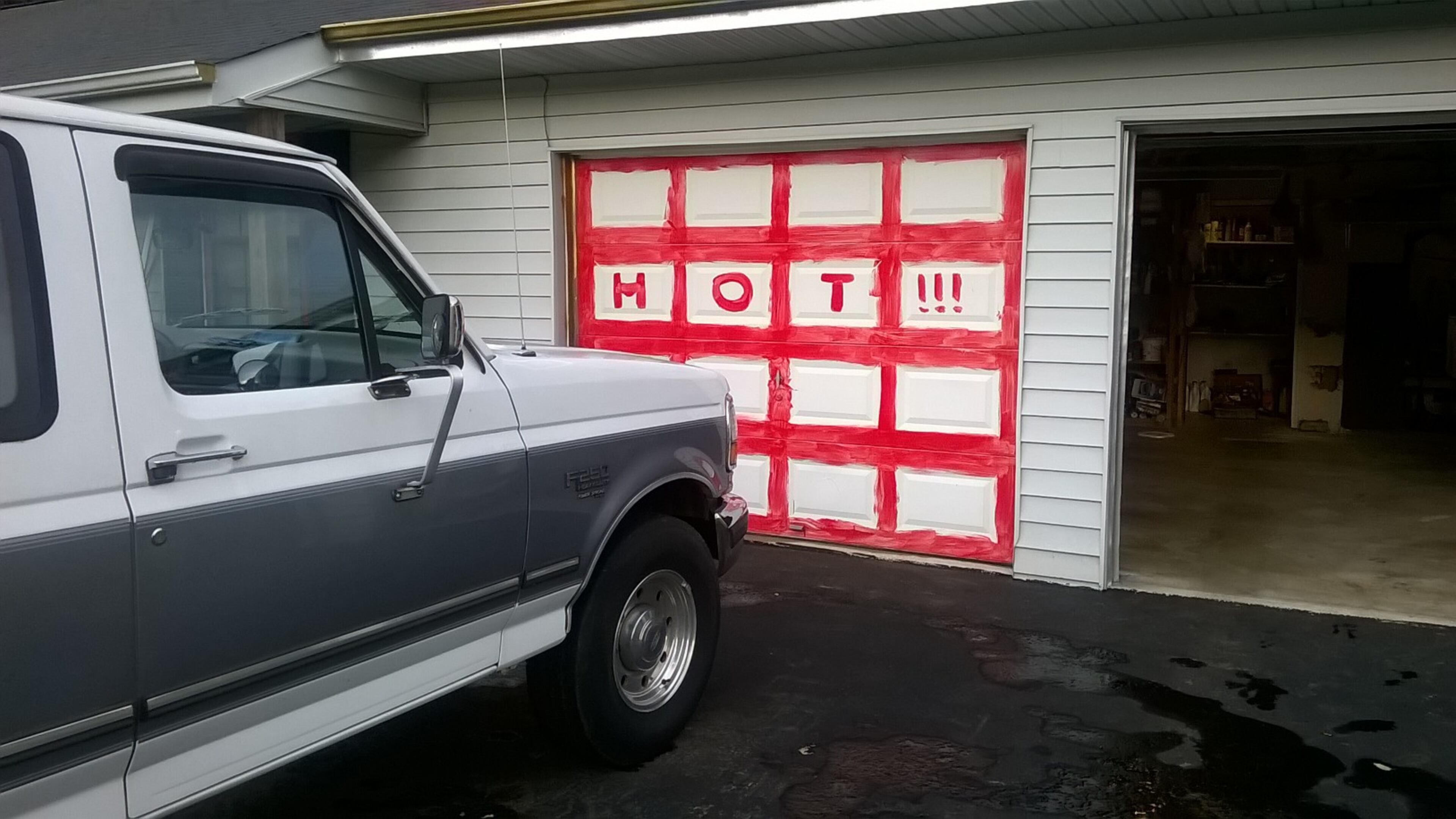 Neighbors said William Arnett changed in recent months and painted his garage doors. (Credit: Carolyn Cunningham)