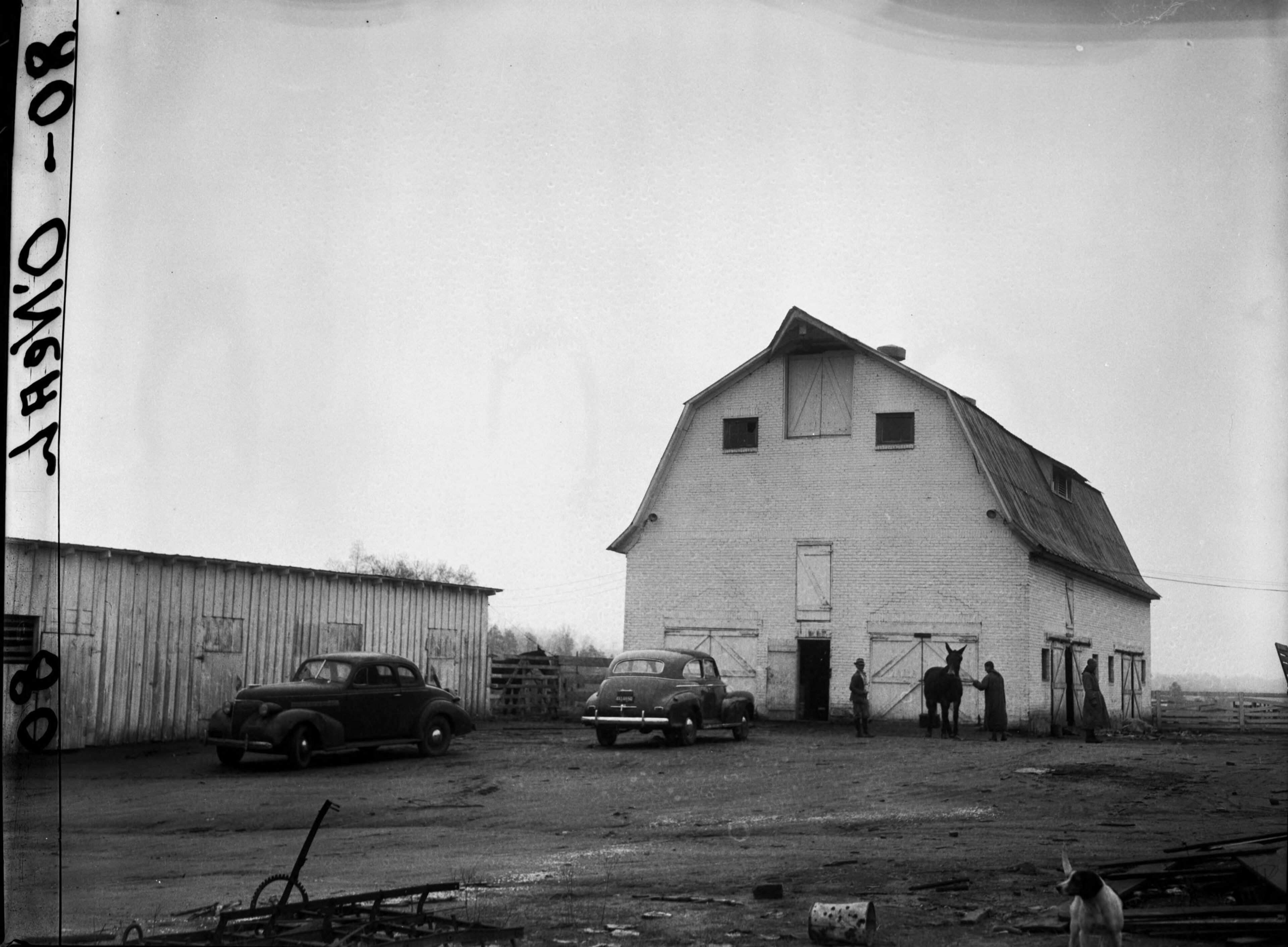 Trappist monks setting up their monastery near Conyers in 1944. As the website reads today, "In 1944, twenty one Trappist monks left Gethsemani Abbey in Kentucky and embarked on a journey similar to those originating in early Christianity. The trip led them to the wilderness of rural Georgia where they founded the Monastery of the Holy Spirit." N01-086_06, Tracy O'Neal Photographic Collection, 1923-1975, Photographic Collection. Special Collections and Archives, Georgia State University Library.