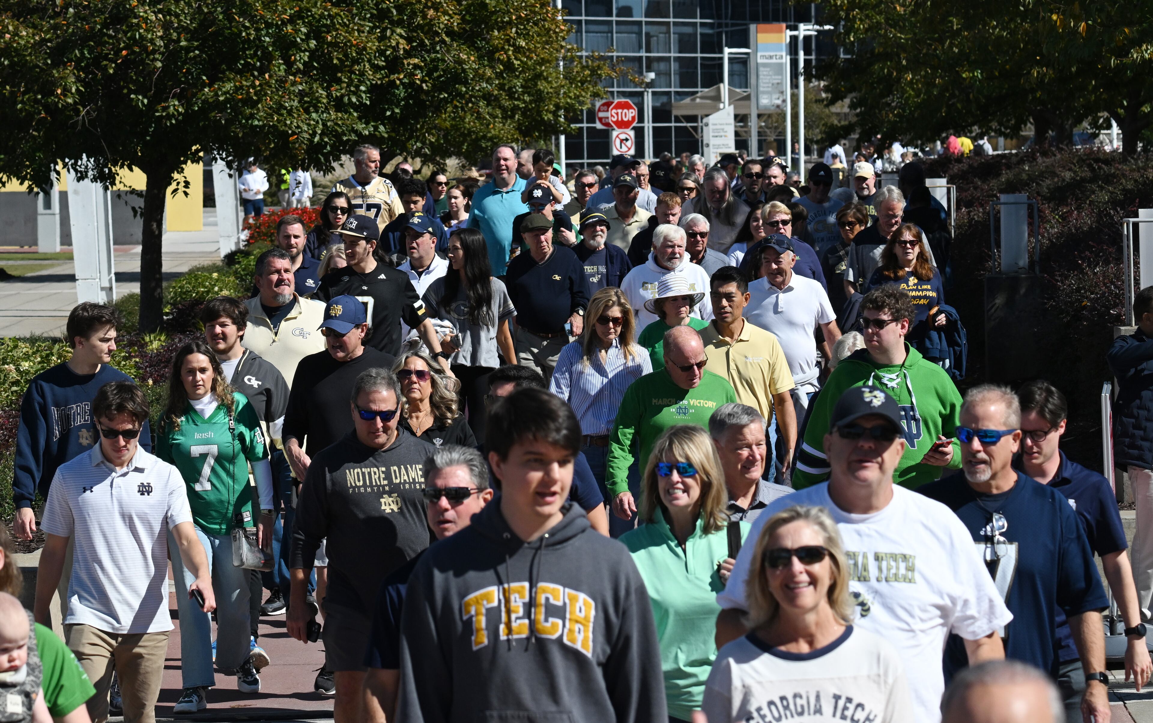 Football fans arrive before a NCAA football game between Georgia Tech and Notre Dame at Mercedes-Benz Stadium, Saturday, October 19, 2024, in Atlanta. (Hyosub Shin / AJC)