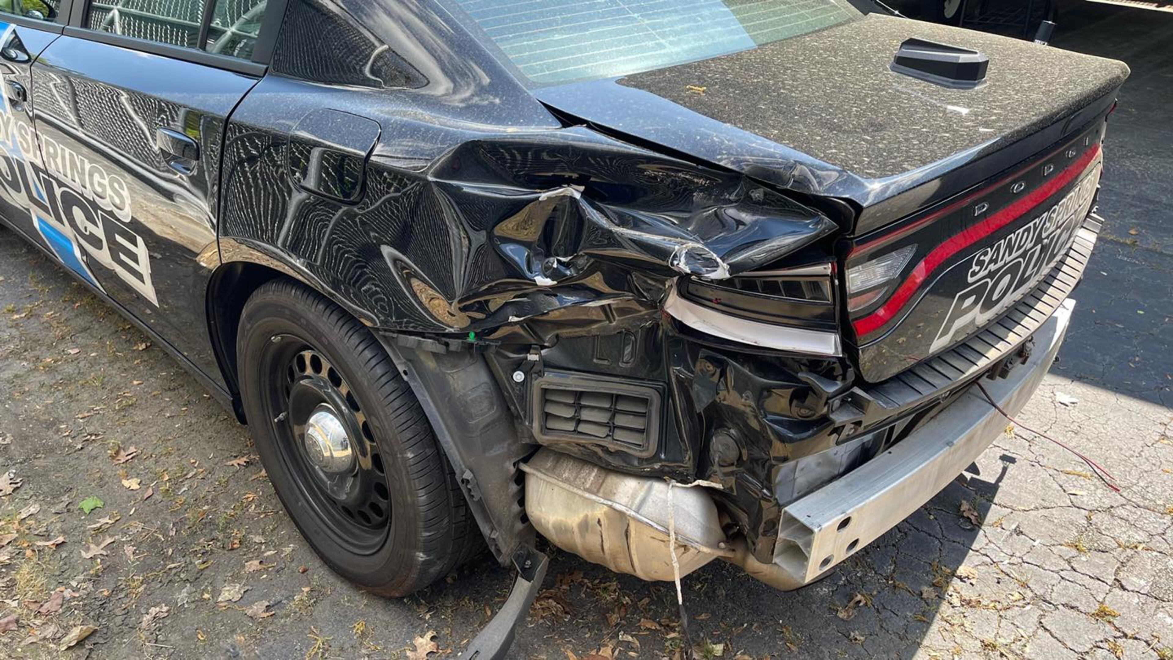 Police said the officer crashed when the Dodge Challenger cut across several lanes of the freeway and the officer tried to follow it.