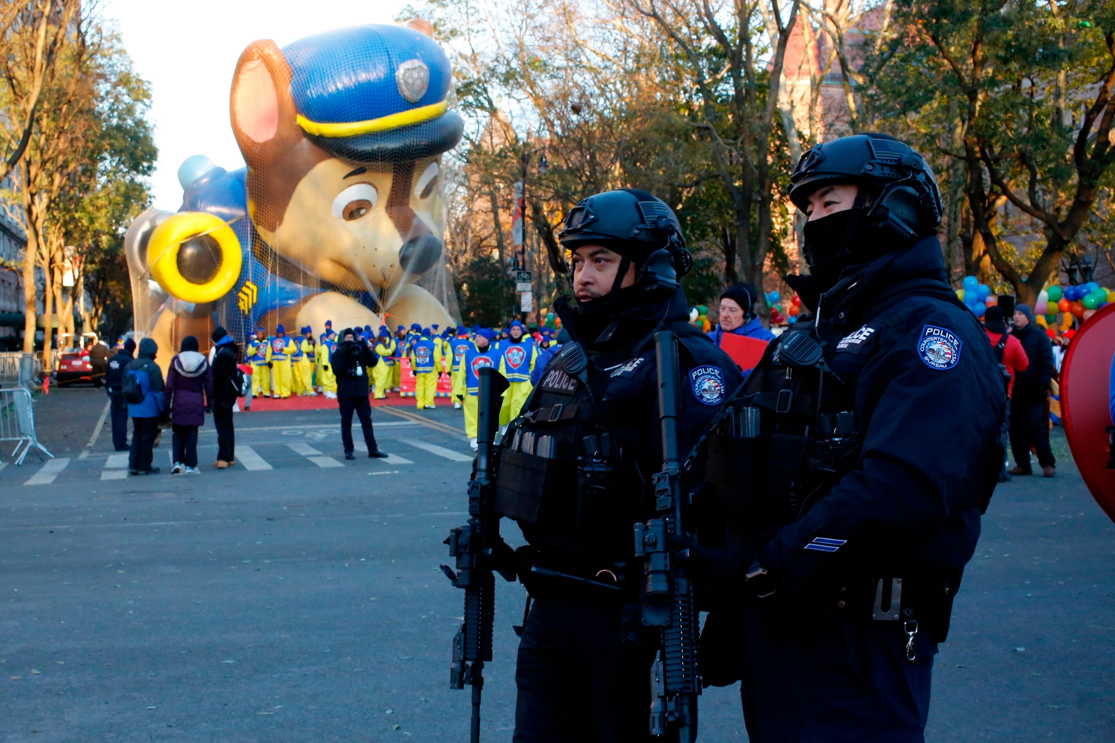 Members of the New York Police Department take a position along the route before the start of the 92nd annual Macy's Thanksgiving Day Parade in New York, Thursday, Nov. 22, 2018. (AP Photo/Eduardo Munoz Alvarez)