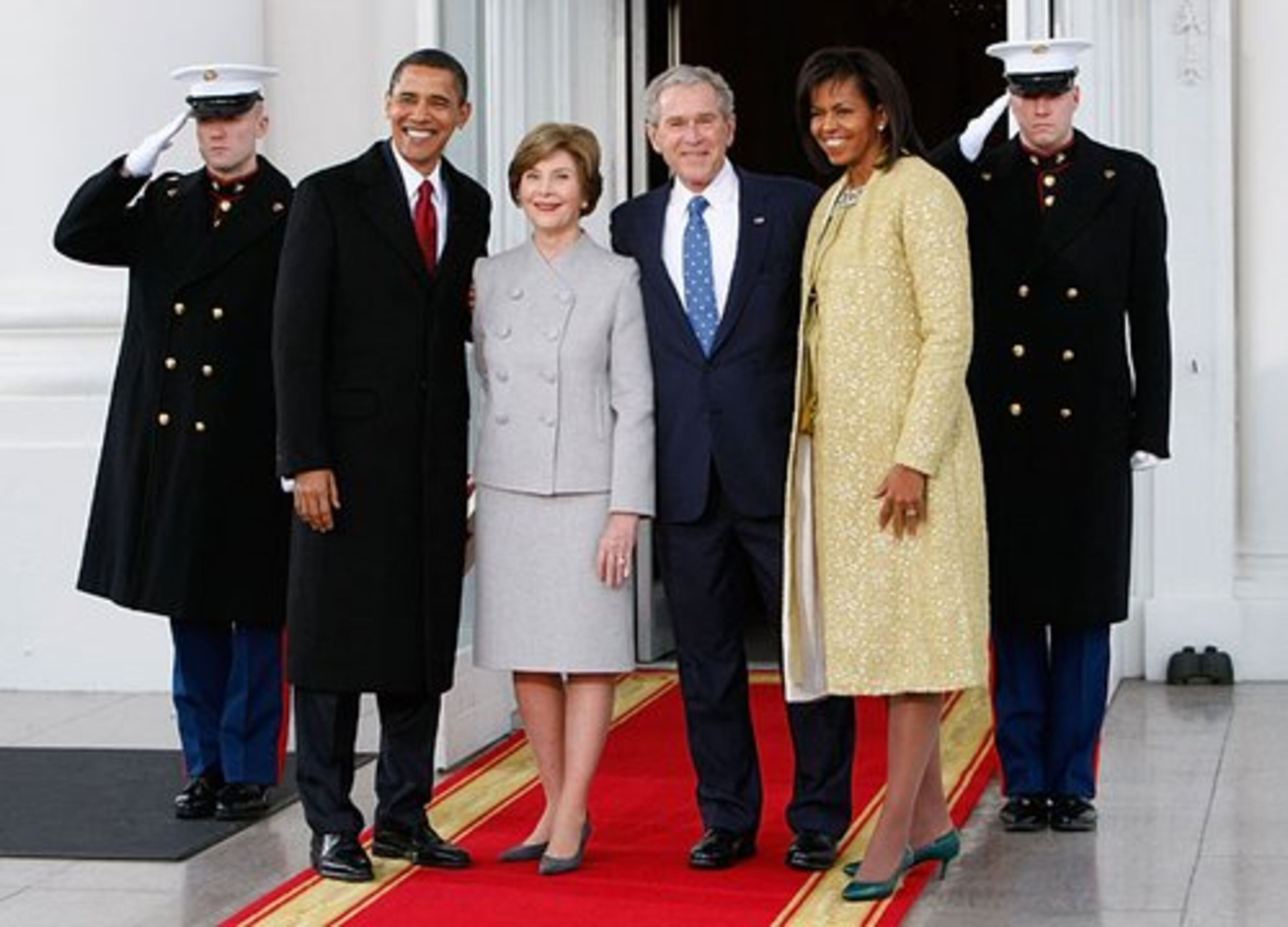 The Bushes welcome the Obamas on the North Portico of the White House.