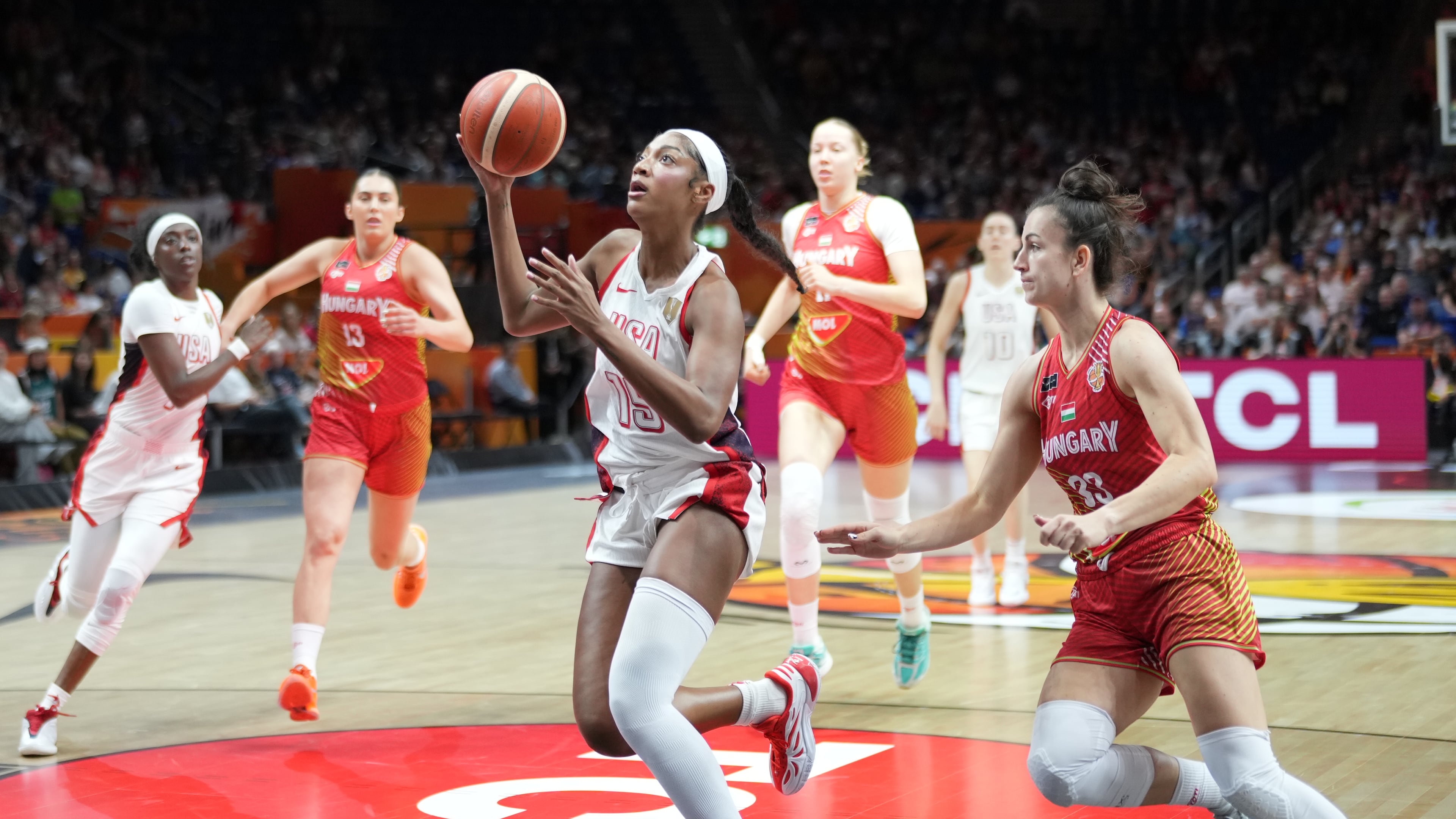 Angel Reese, of the United States, gies for a shot in front pf Hungary's Panka Dul during the Women's Basketball World Cup quarterfinal match between the United States and Hungary in Berlin, Thursday, Sept. 10, 2026. (AP Photo/Ebrahim Noroozi)