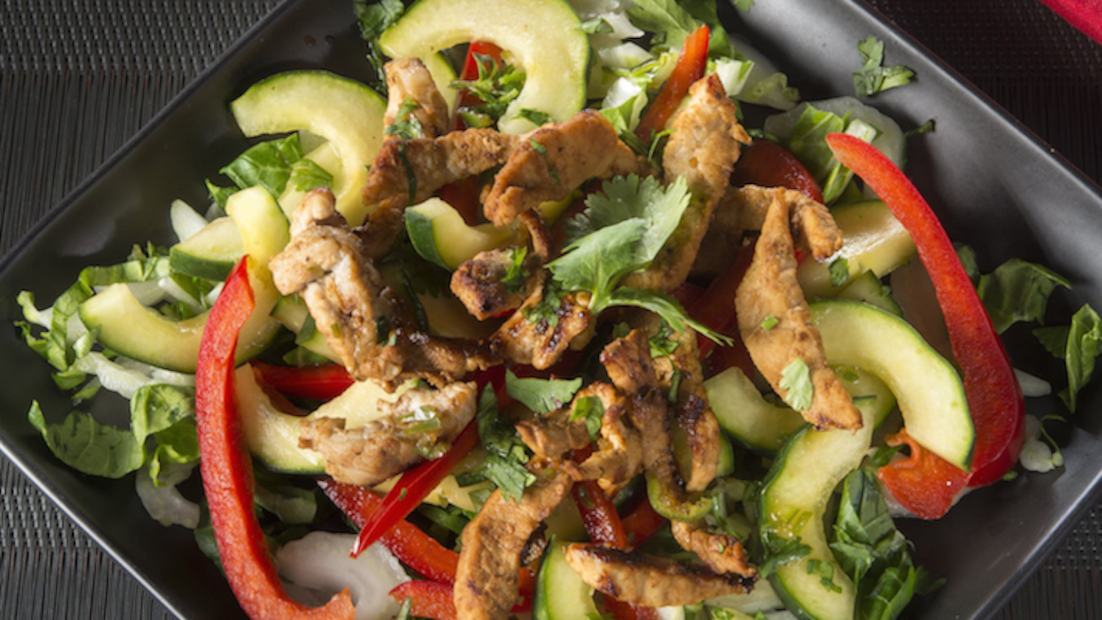 Thai Pork and Cucumber is a light and flavorful stir-fry/salad combination. (Tammy Ljungblad/Kansas City Star/TNS)