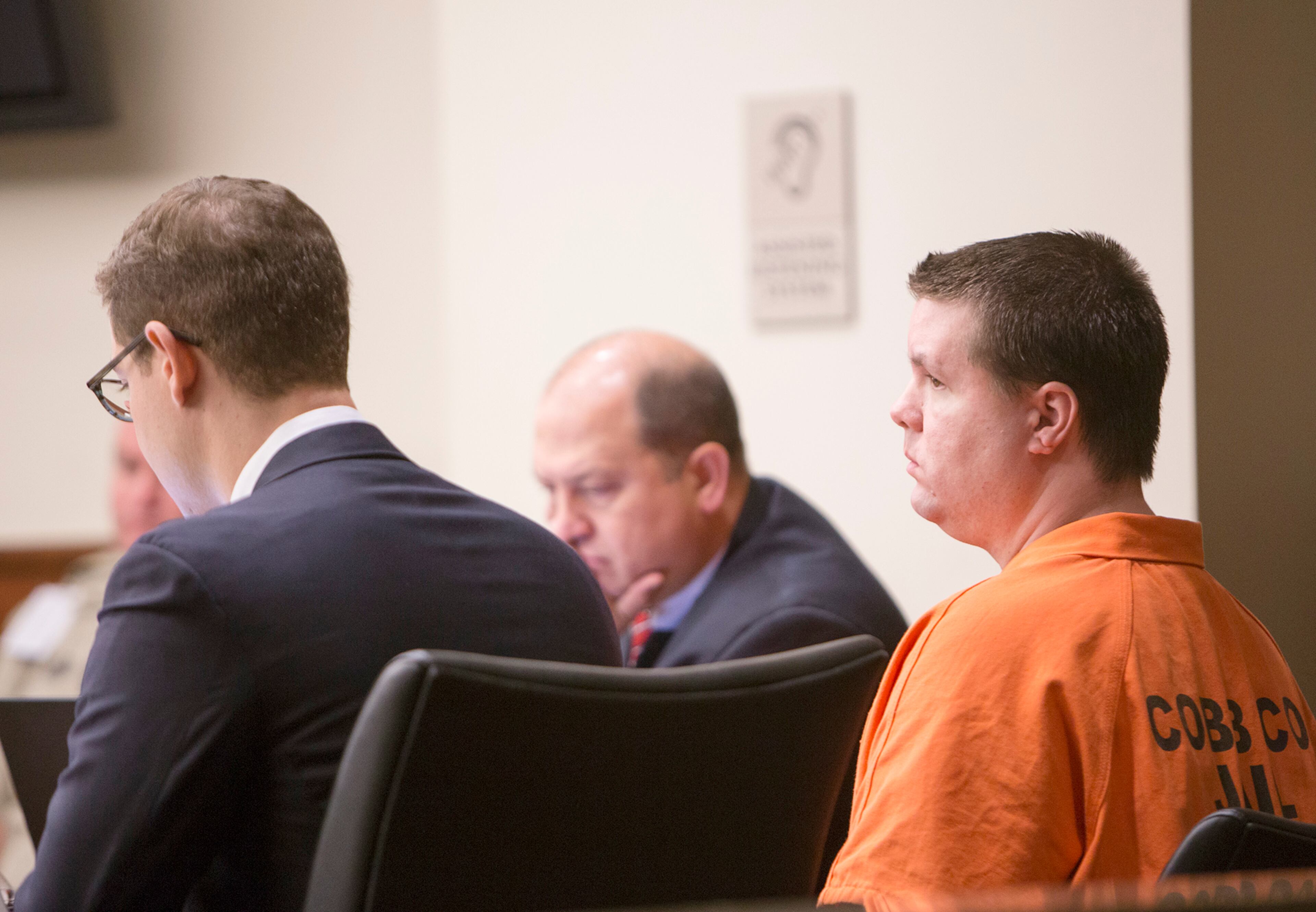 Justin Ross Harris, right, sits in the courtroom for a hearing Monday, Sept. 14, 2015, in Marietta, Ga. A judge on Monday refused to bar the news media from the courtroom during pretrial hearings for Harris, a Georgia man accused of killing his toddler son by leaving him in a vehicle on a hot day. (Kathryn Ingall/The Marietta Daily Journal via AP, Pool)
