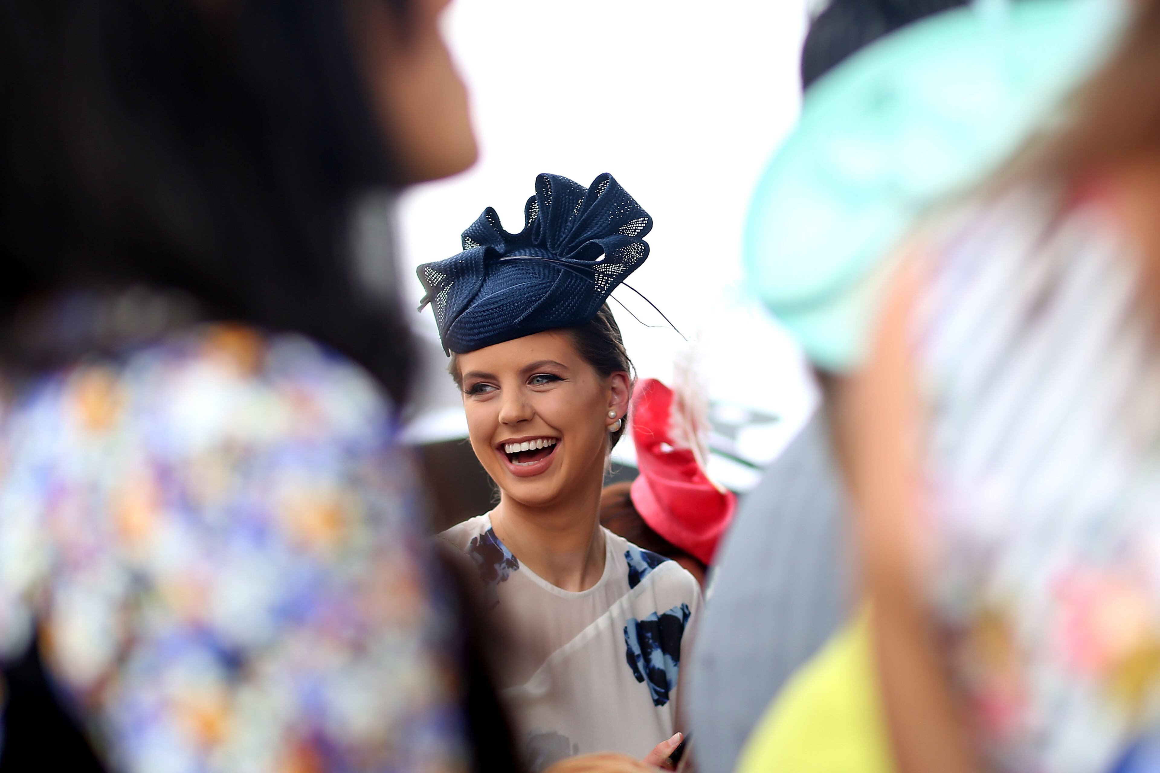 MELBOURNE, AUSTRALIA - NOVEMBER 05: A racegoer enjoys the atmosphere on Crown Oaks Day at Flemington Racecourse on November 5, 2015 in Melbourne, Australia. (Photo by Graham Denholm/Getty Images for the VRC)