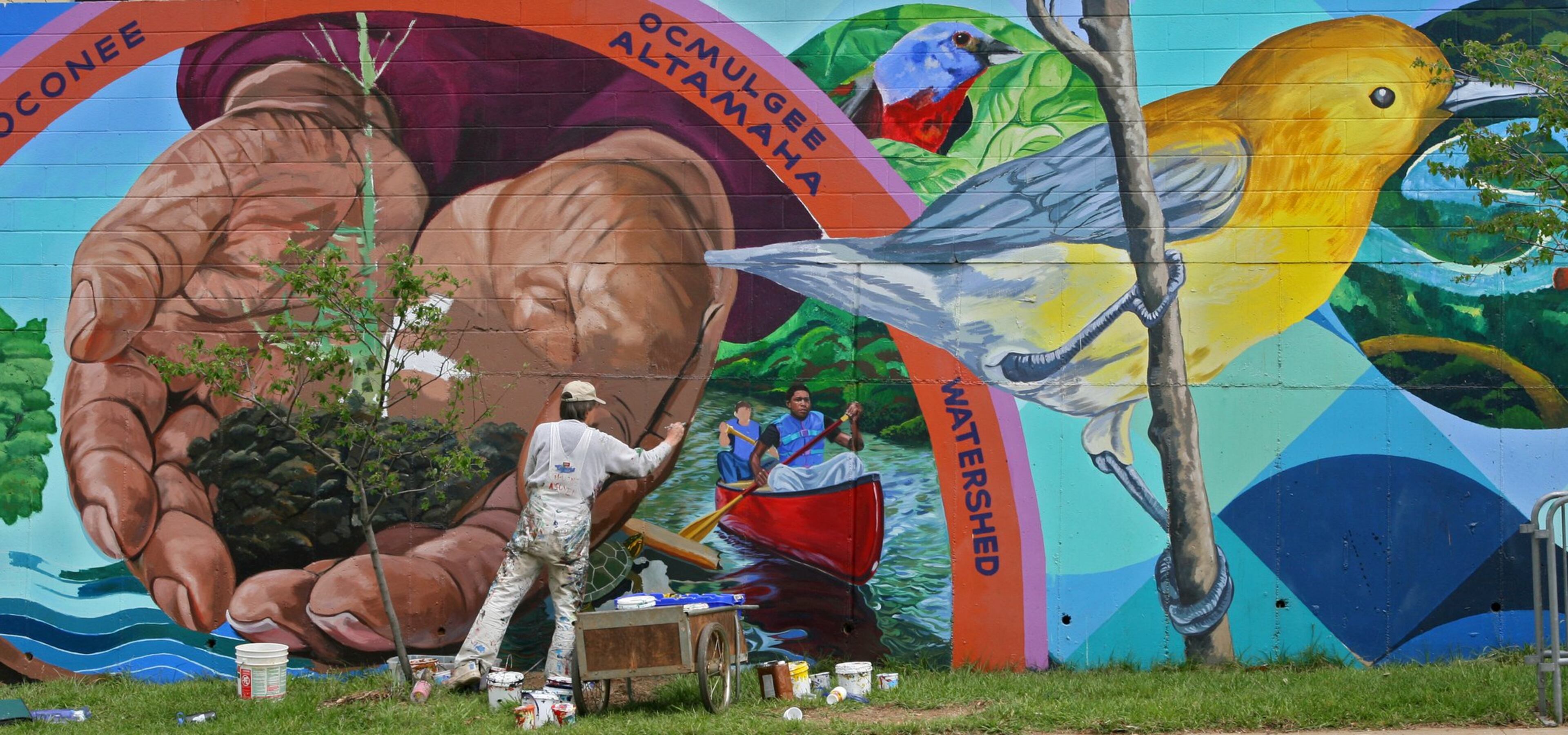 “Native Waters” by Boston artist David Fichter is one of the longest-tenured murals in the intown area — as well as one of the longest, at 340 feet. STAFF PHOTO