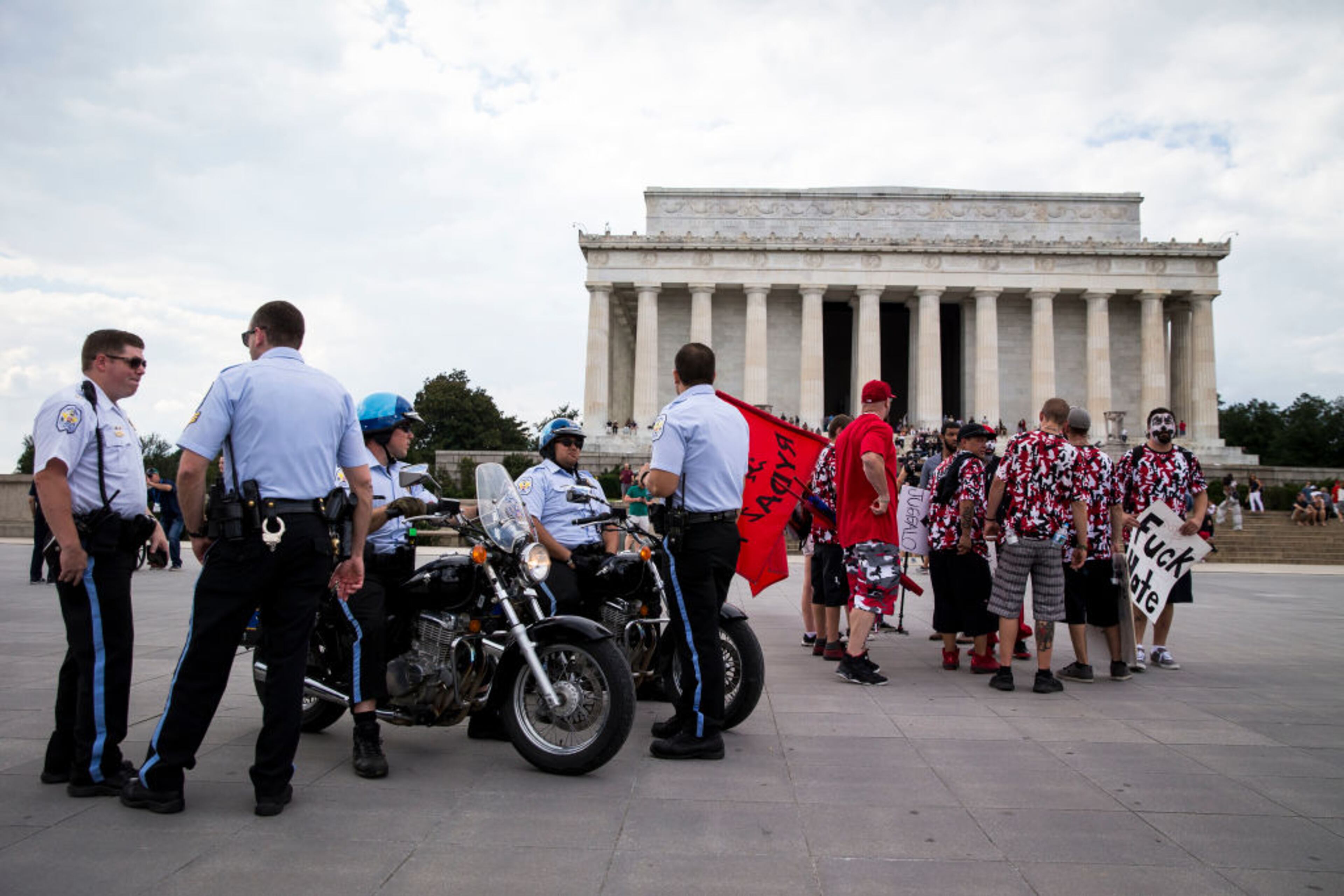 WASHINGTON, DC - SEPTEMBER 16: U.S. Park Police stand next to people gathered for a rally before the start of the Juggalo March, at the Lincoln Memorial on the National Mall, September 16, 2017 in Washington, DC. Fans of the band Insane Clown Posse, known as Juggalos, are protesting their identification as a gang by the FBI in a 2011 National Gang Threat Assessment. (Photo by Al Drago/Getty Images)