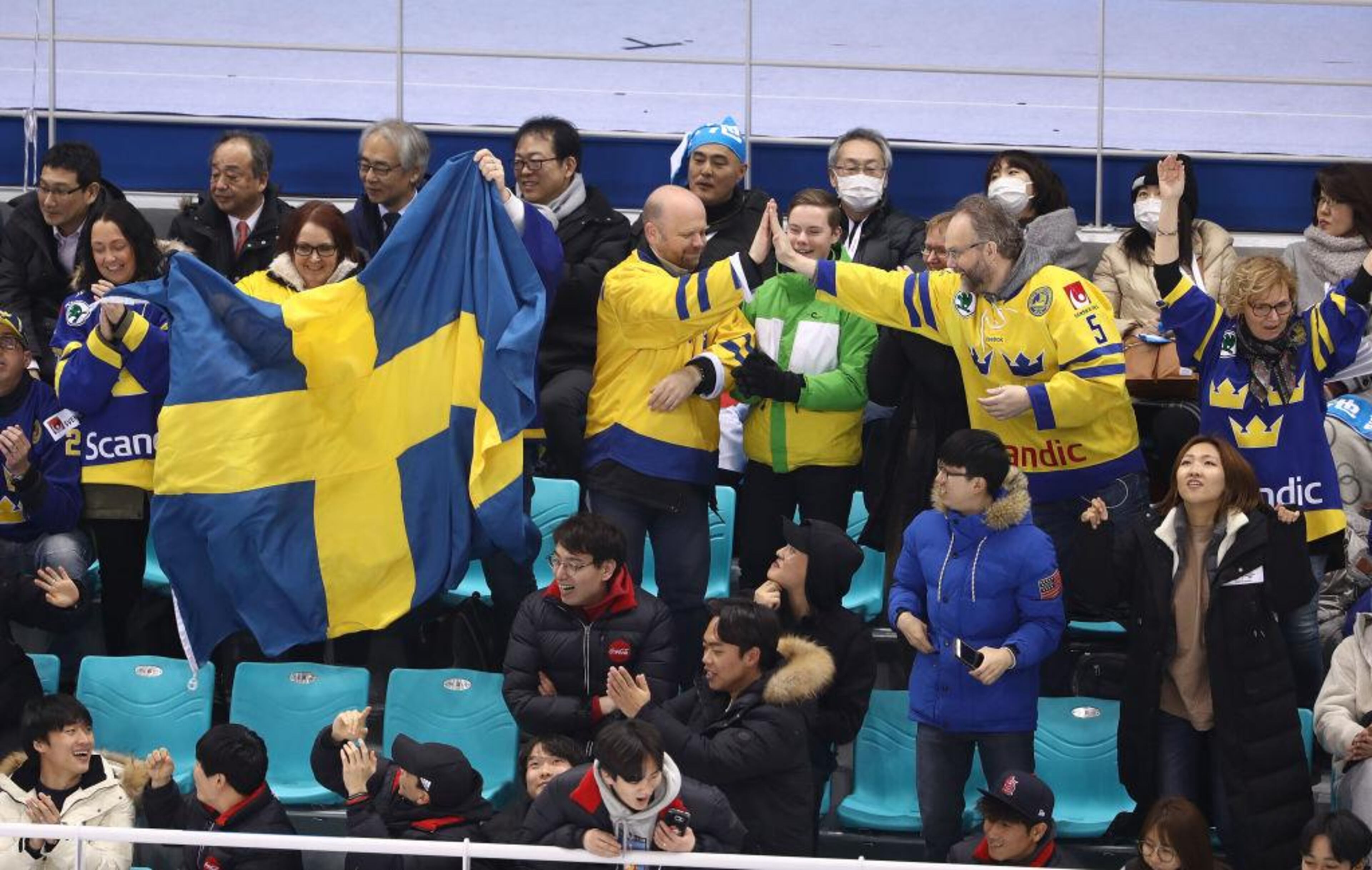 GANGNEUNG, SOUTH KOREA - FEBRUARY 10: Swedish fans cheer during the Women's Ice Hockey Preliminary Round, Group B match between Japan and Sweden on day one of the PyeongChang 2018 Winter Olympic Games at Kwandong Hockey Centre on February 10, 2018 in Gangneung, South Korea. (Photo by Robert Cianflone/Getty Images)