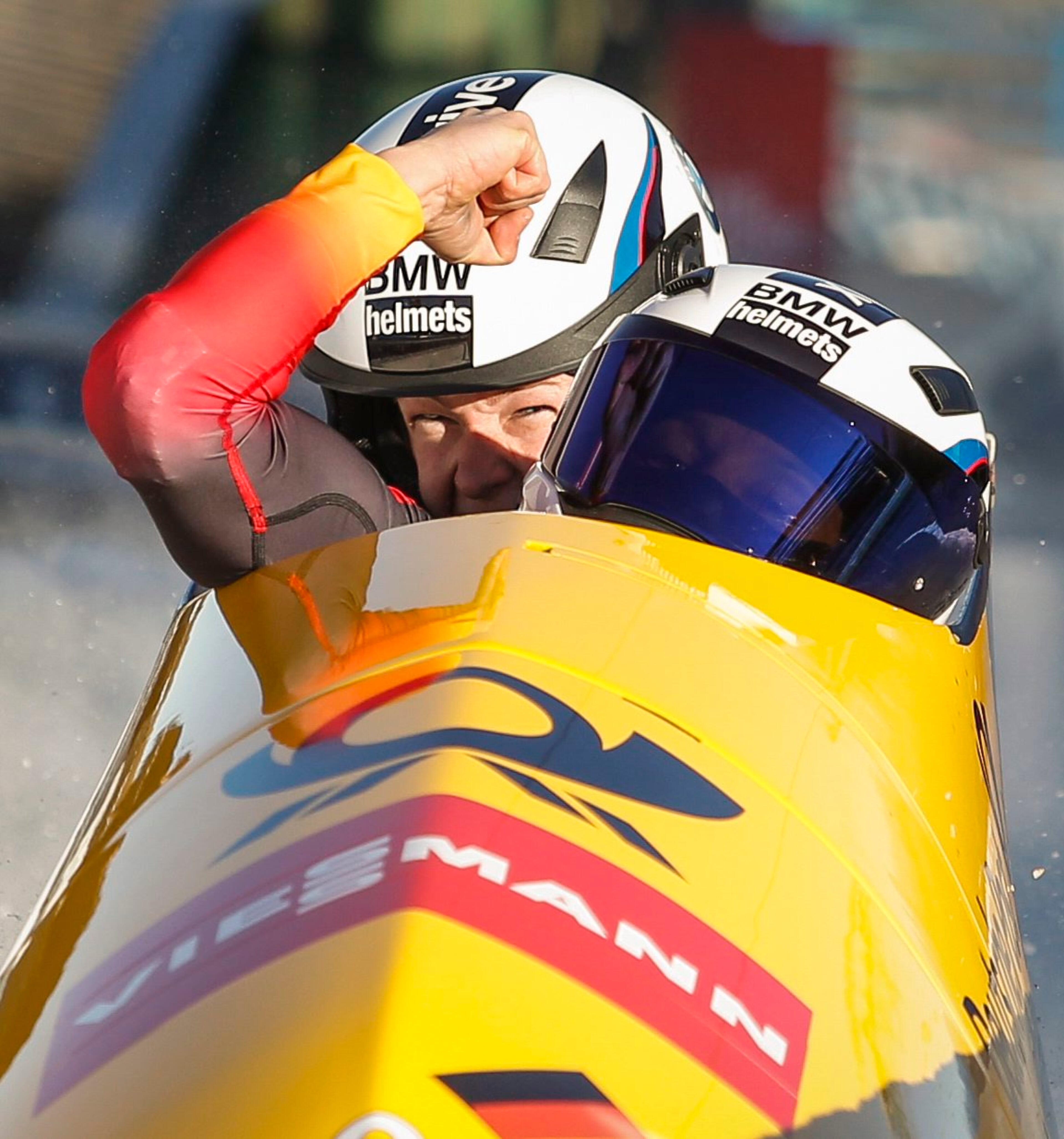 Germany's Anja Schneiderheinze and Franziska Bertels celebrate finishing second at the women's World Cup bobsled event in Calgary, Alberta, Canada on Saturday, Dec. 20, 2014. (AP Photo/The Canadian Press, Jeff McIntosh)