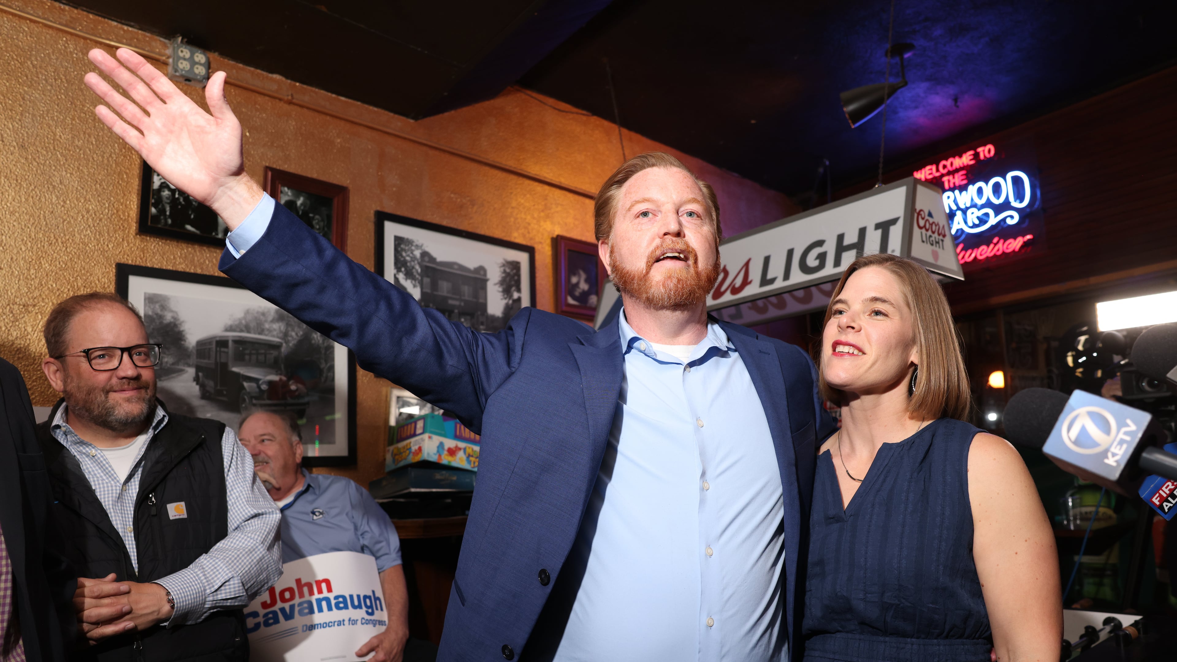 State Sen. John Cavanaugh, candidate for the Democratic nomination to the House of Representatives in Nebraska's second district, left, stands with his wife, Kakie McGill, during an election night watch party Tuesday, May 12, 2026, in Omaha, Neb. (AP Photo/Rebecca S. Gratz)