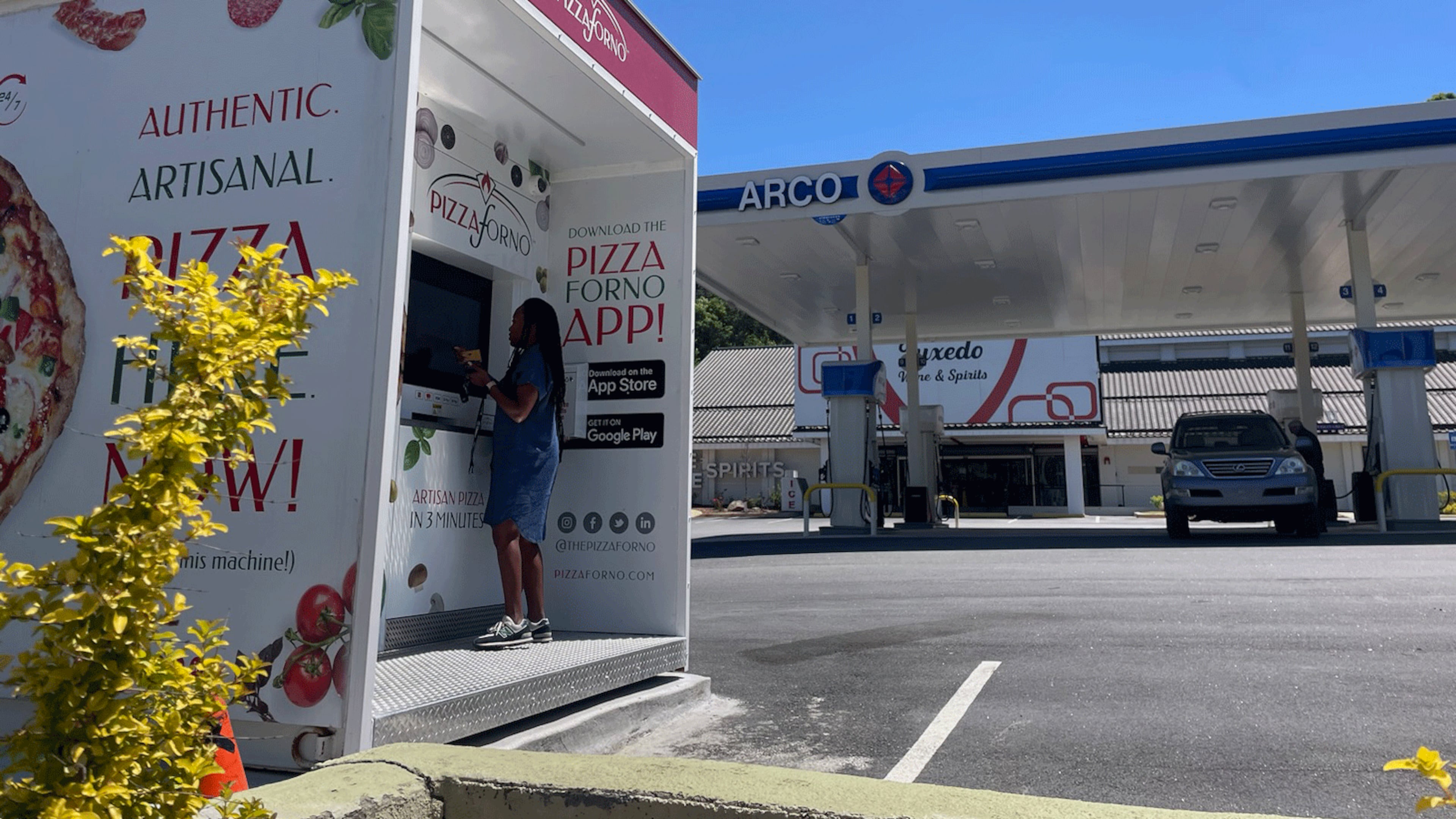 A customer orders from the automated PizzaForno kiosk. / Courtesy of PizzaForno