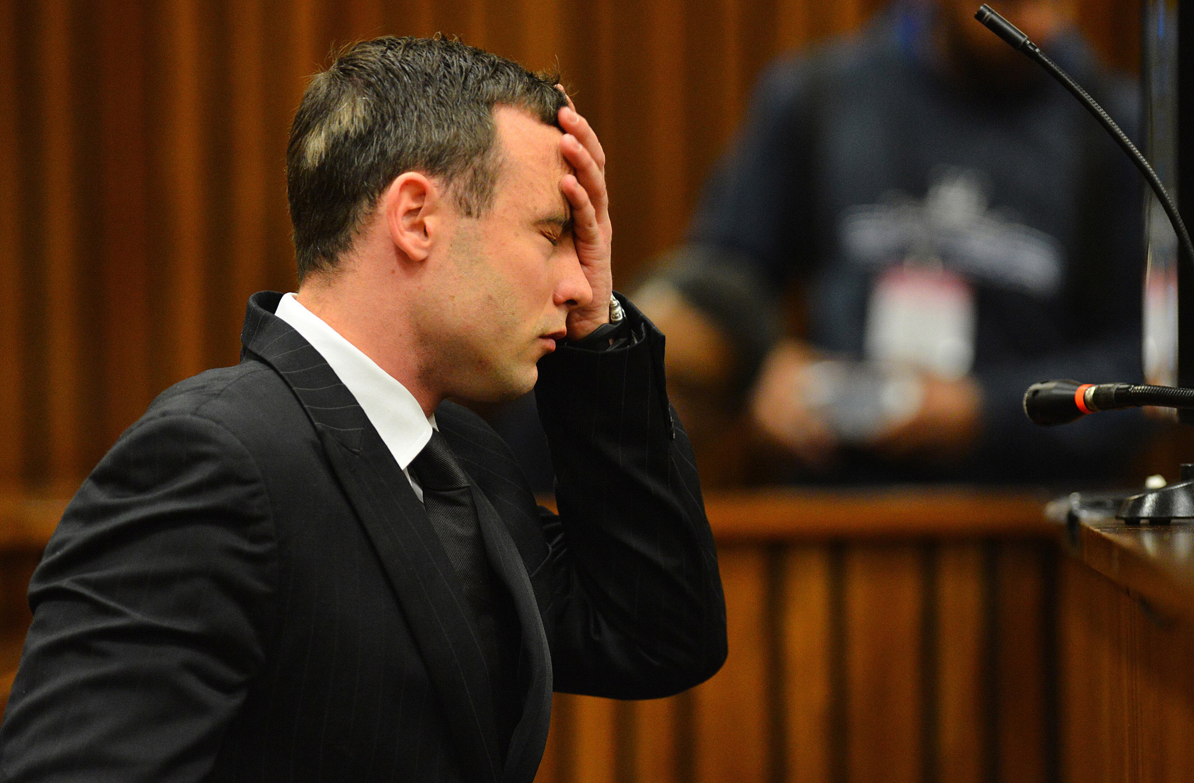 Oscar Pistorius listens to evidence in court in Pretoria, South Africa, June 30, 2014. The murder trial of Pistorius resumed Monday,after one month during which mental health experts evaluated the athlete to determine if he has an anxiety disorder that could have influenced his actions on the night he killed girlfriend Reeva Steenkamp. (AP Photo/Phill Magakoe, Pool)