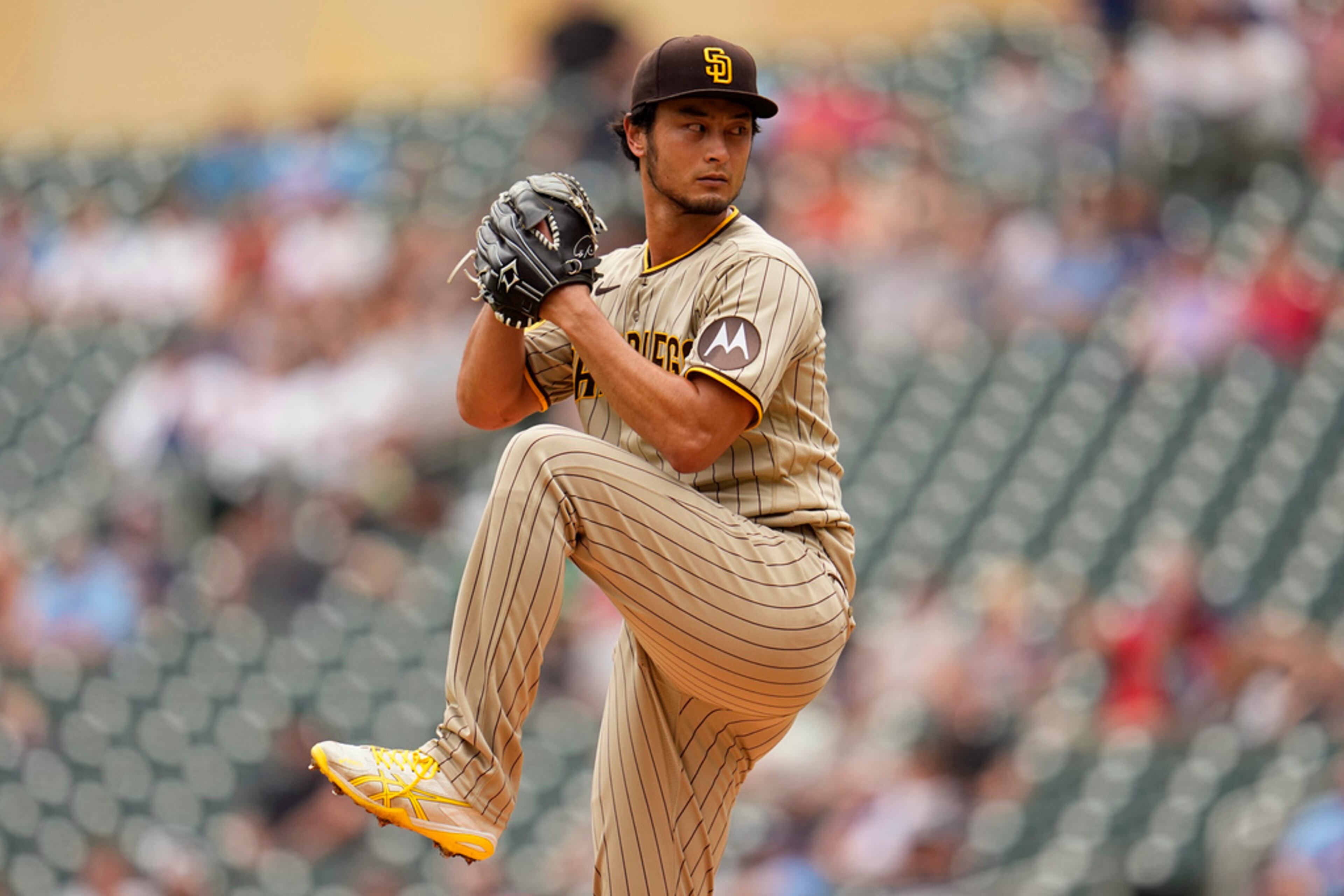 The San Diego Padres have a large round Motorola patch. (AP Photo/Abbie Parr)