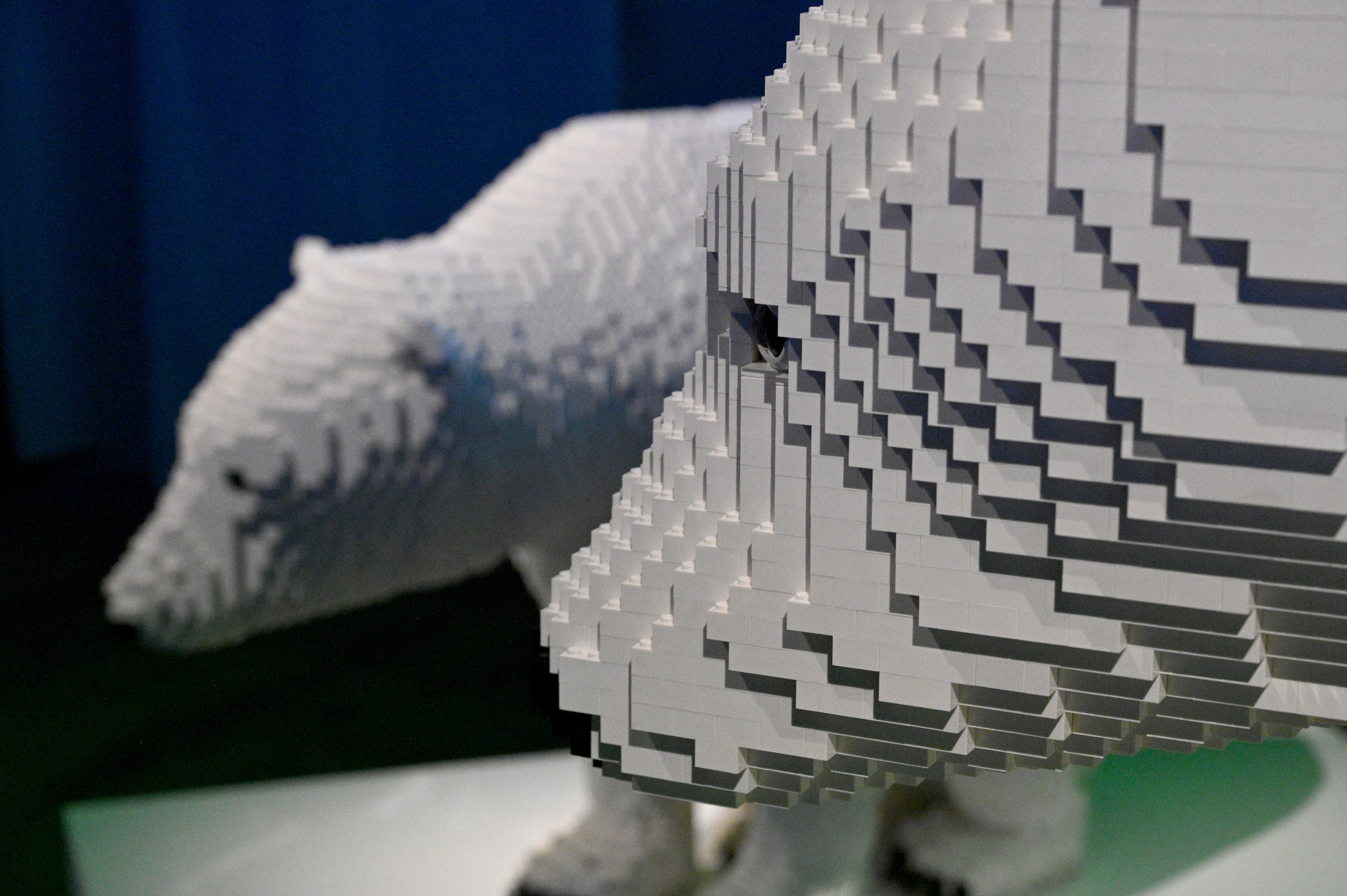 “Polar Bear and Cub” made with 50,726 Lego bricks in “Perniciem” room at "Art of the Brick Immersive Experience" exhibition at Exhibition Hub Atlanta Art Centre, Wednesday, April 19, 2023, in Doraville. The exhibition will feature many pieces and themes, including a room with oversized sculptures (25-foot long), over 70 works of art crafted from more than 1 million LEGO bricks, galleries celebrating human-kind and nature, and a short documentary about how Nathan creates his works. (Hyosub Shin / Hyosub.Shin@ajc.com)