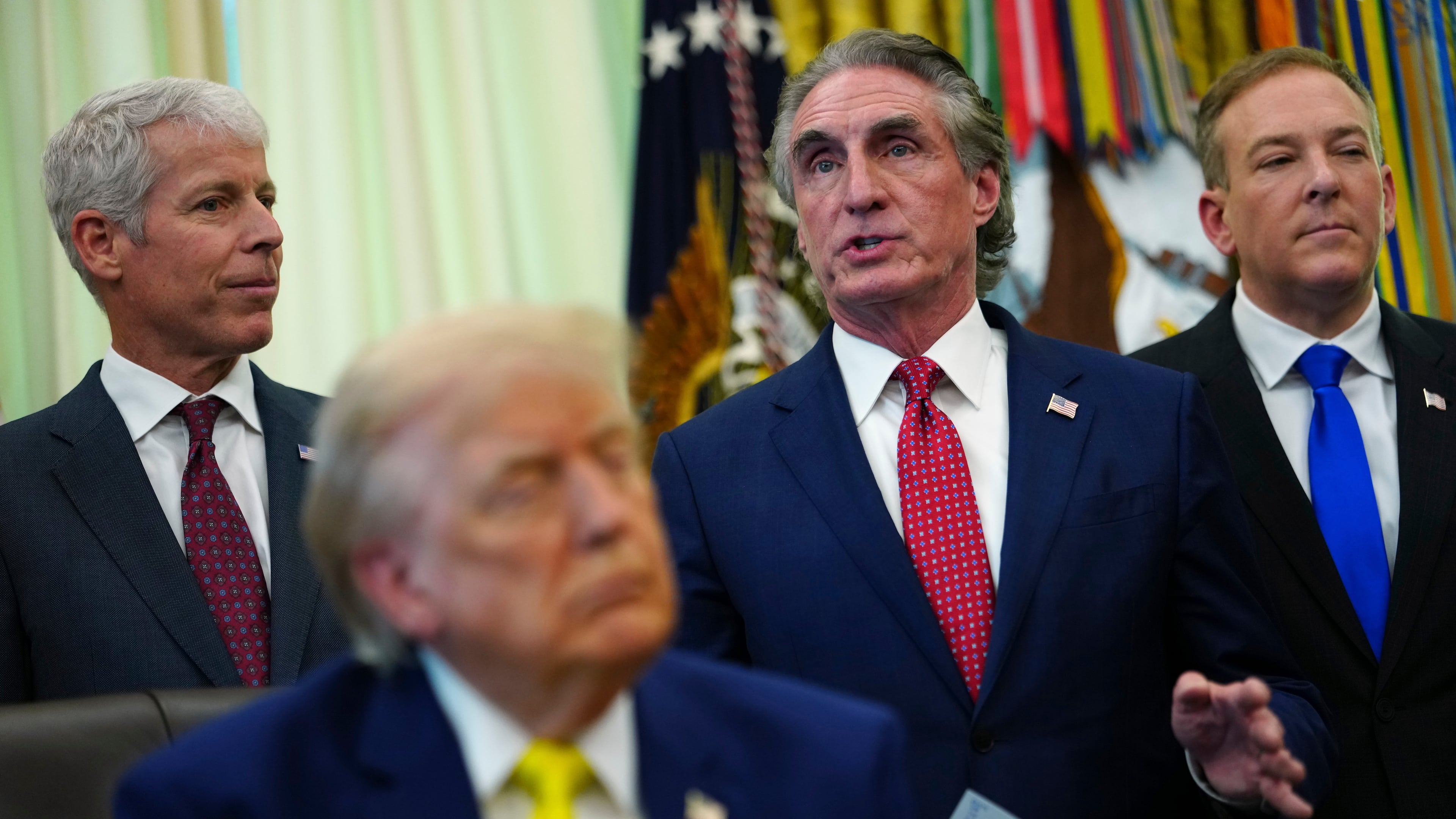 Interior Secretary Doug Burgum speaks as President Donald Trump, foreground, and from left, Energy Secretary Chris Wright and Environmental Protection Agency administrator Lee Zeldin, listen at an event about coal, Thursday, June 4, 2026, in the Oval Office of the White House in Washington. (AP Photo/Julia Demaree Nikhinson)