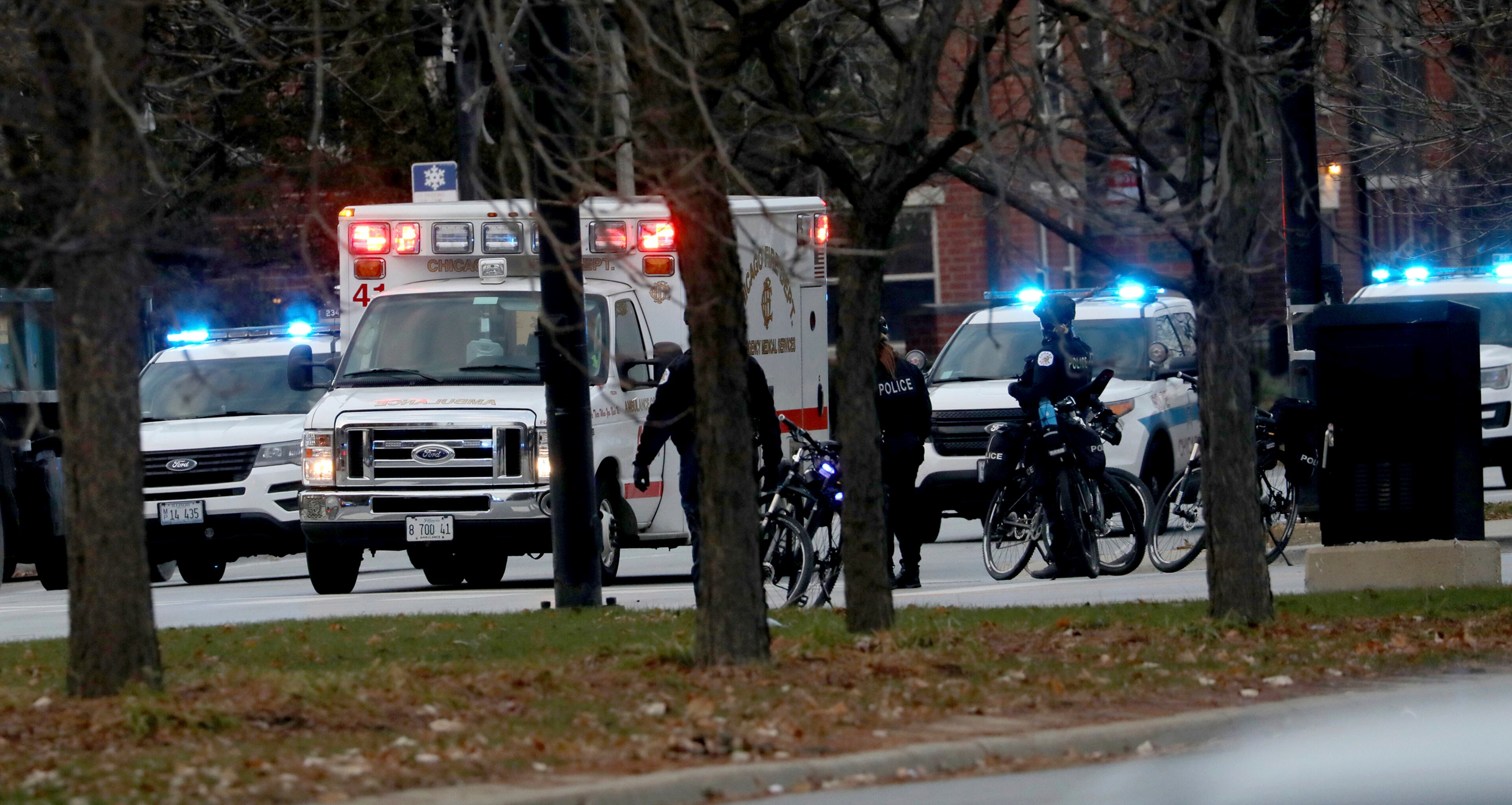 An ambulance believed to be carrying an injured Chicago police officer departs Mercy Hospital Monday, Nov. 19, 2018, in Chicago. A shooting at a Chicago hospital has wounded multiple people, including a suspect and a police officer, authorities said. Shots were fired Monday at Mercy Hospital on the city's South Side, and officers were searching the facility. Police issued a statement on Twitter saying there were "reports of multiple victims." (Zbigniew Bzdak/Chicago Tribune via AP)