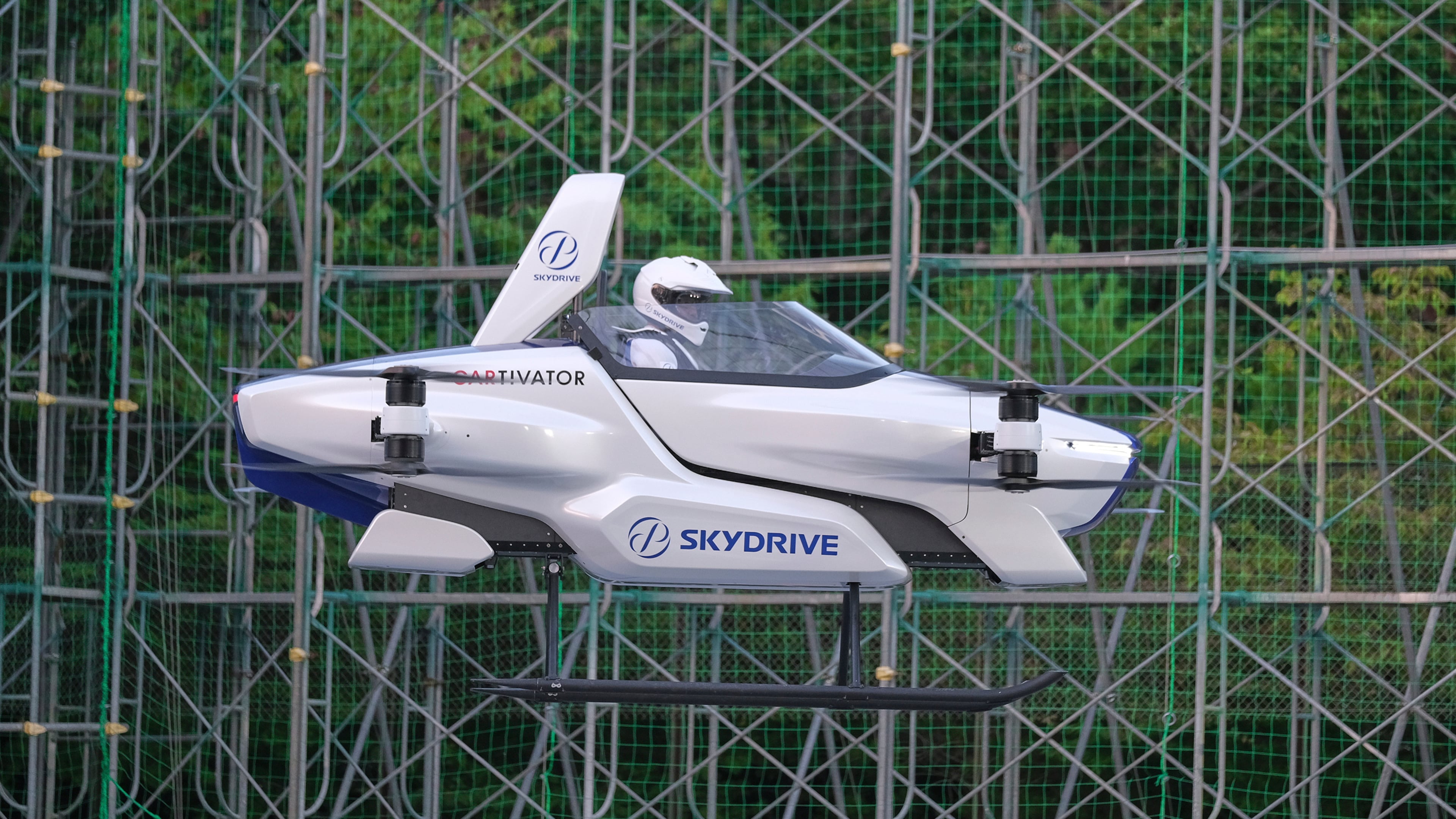 This photo taken at the beginning of August and released by ©SkyDrive/CARTIVATOR 2020 shows a test flight of a manned "flying car" at Toyota Test Field in Toyota, central Japan. Japan’s SkyDrive Inc., among myriads of “flying car” projects around the world, has carried out a successful-though-modest test flight with one person aboard.