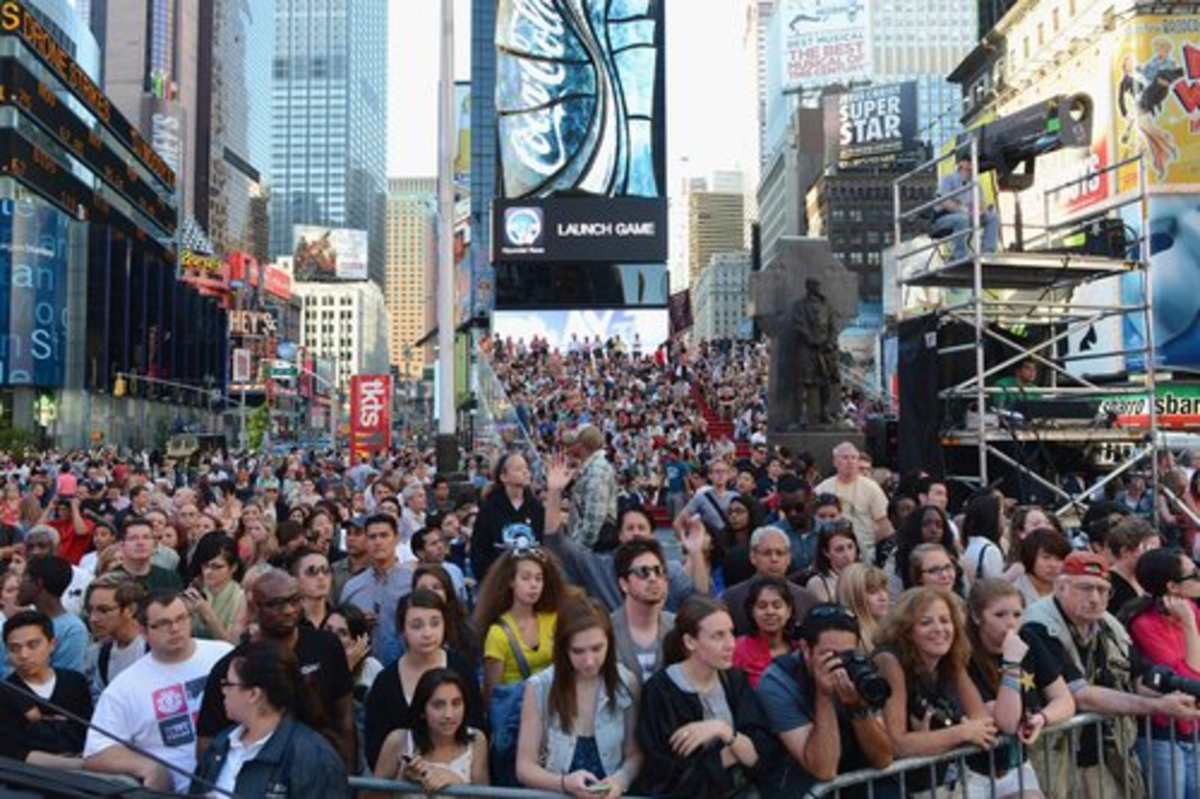 Thousands crowded New York's Times Square for a look at the stars and designs.