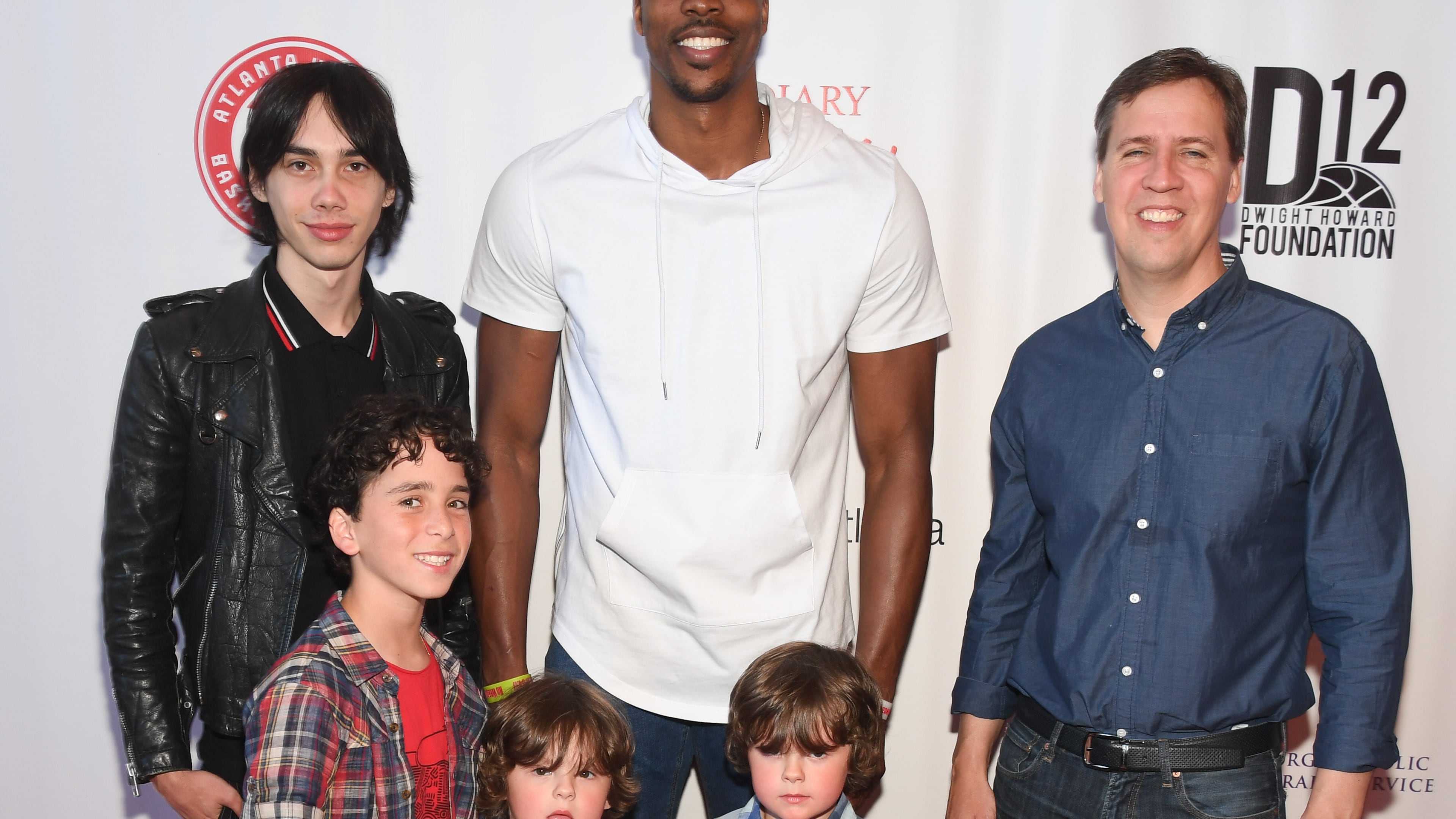Actor Charlie Wright, from left, actor Jason Drucker, twins Dylan and Wyatt Walters, Atlanta Hawks player Dwight Howard and author Jeff Kinney attend the"Diary Of A Wimpy Kid: The Long Haul" Atlanta screening hosted by Dwight Howard at Regal Atlantic Station. Photo by Paras Griffin/Getty Images for D12 Foundation