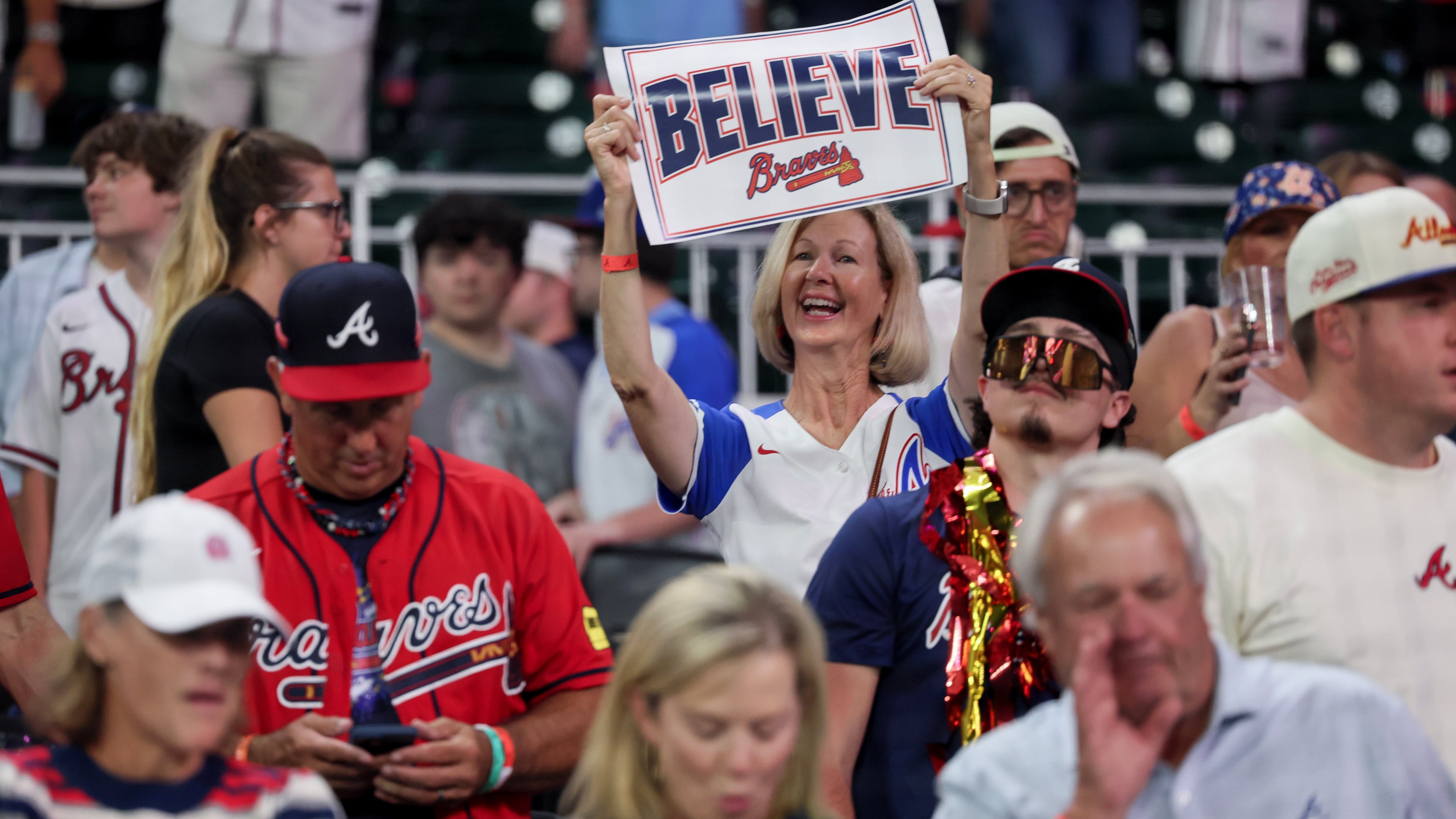 Fans celebrate after the Braves defeat the Phillies during Game 3 to win their National League Wild Card Series on Thursday, Oct. 1, 2026, in Atlanta. Next up, the Braves will take on the Dodgers in a best-of-five series. (Jason Getz/AJC)