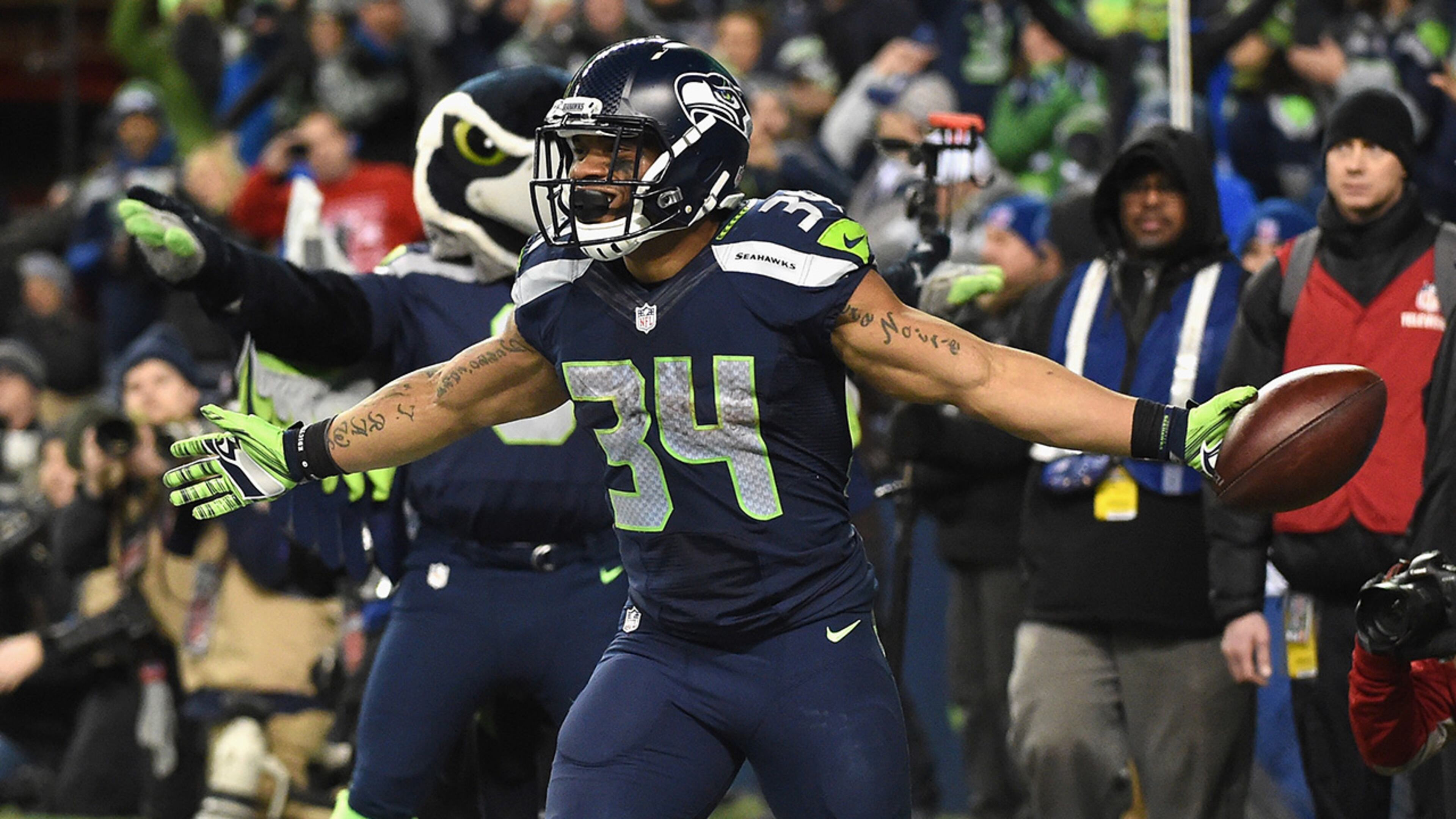 SEATTLE, WA - JANUARY 07: Thomas Rawls #34 of the Seattle Seahawks celebrates scoring a 4-yard touchdown during the fourth quarter against the Detroit Lions in the NFC Wild Card game at CenturyLink Field on January 7, 2017 in Seattle, Washington. (Photo by Steve Dykes/Getty Images)