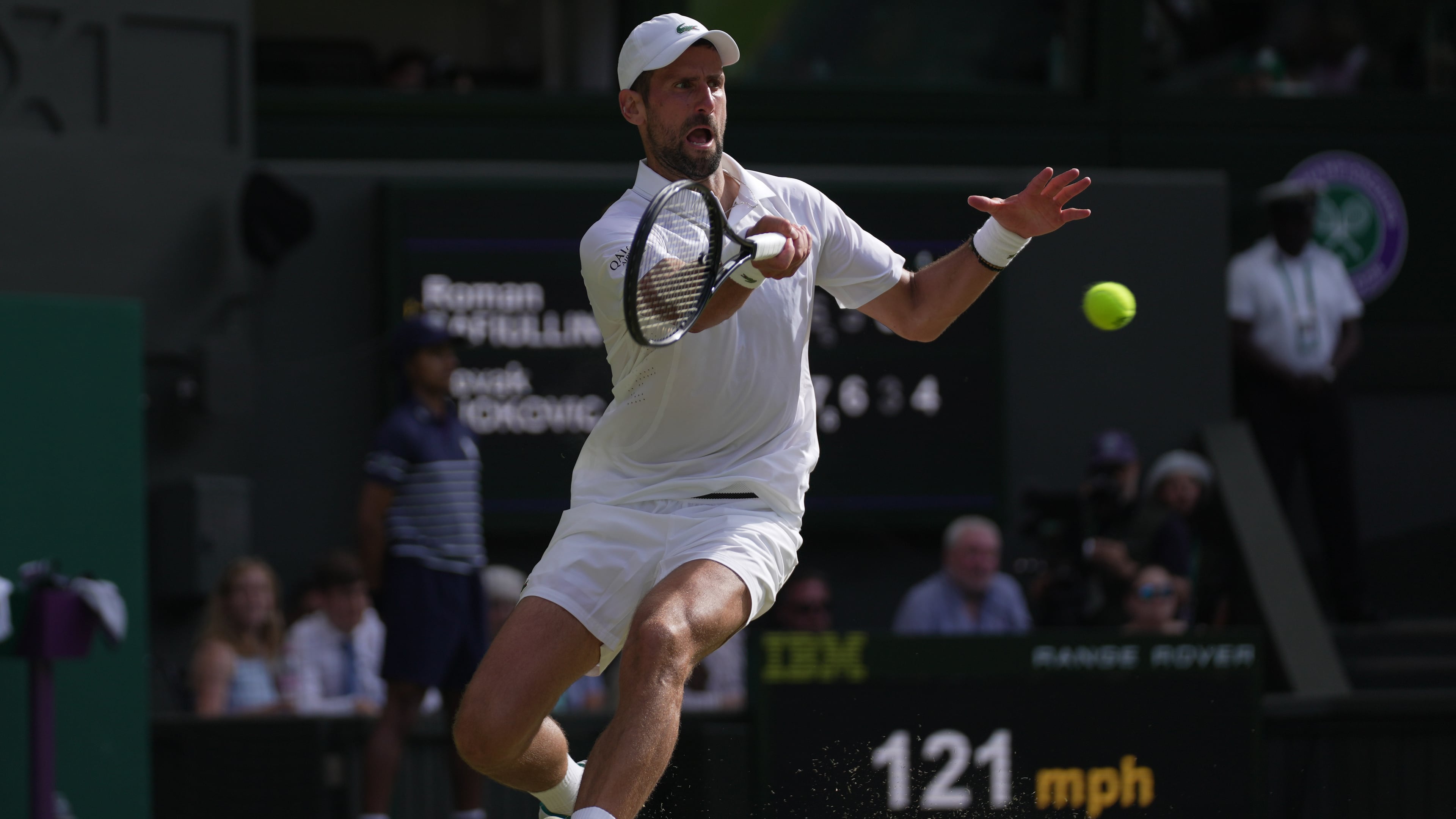 Novak Djokovic of Serbia returns the ball to Roman Saffiulin of Russia in their fourth round men's singles match at the Wimbledon Tennis Championships in London, Sunday, July 5, 2026. (AP Photo/Brian Inganga)