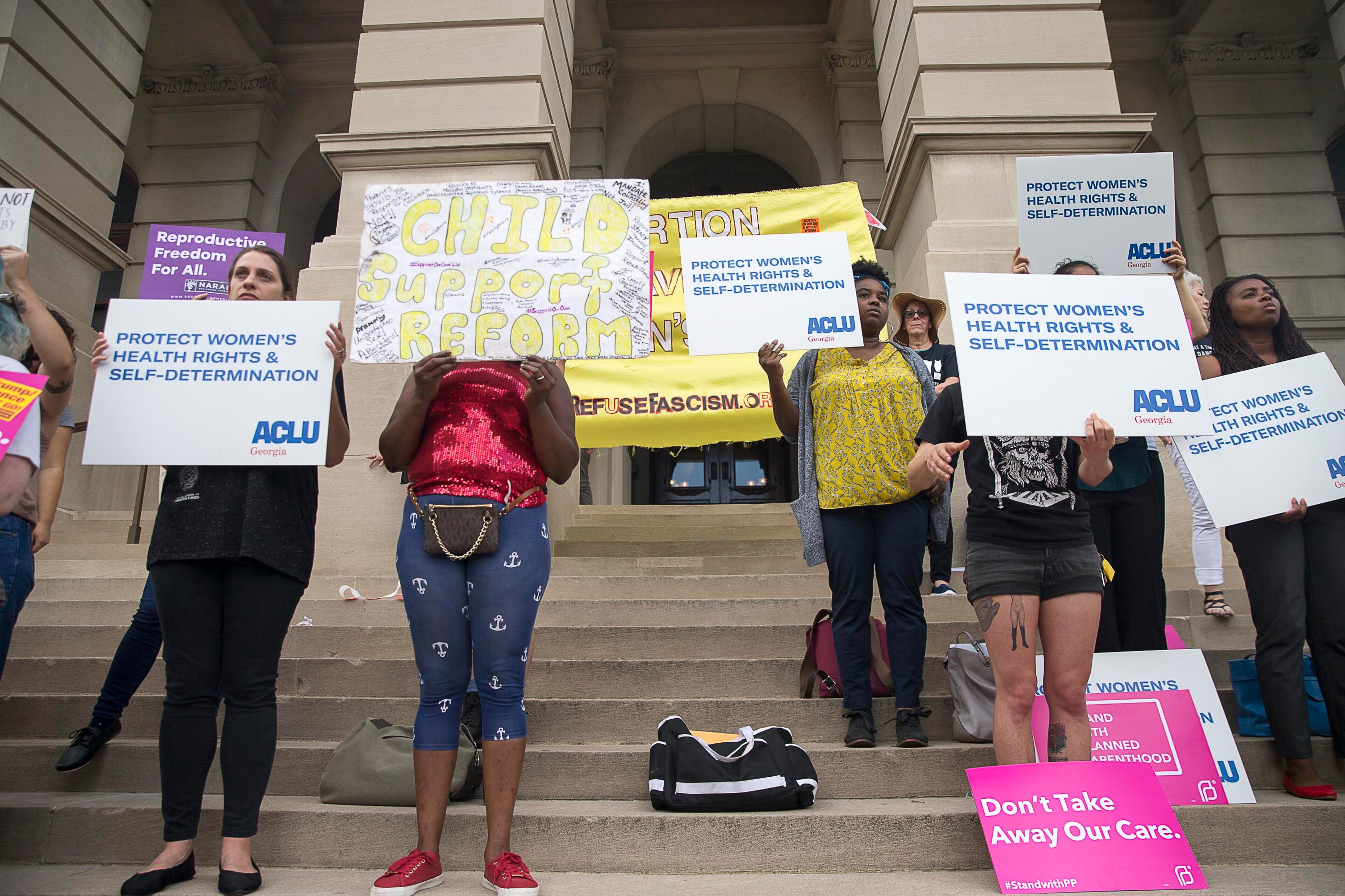 05/07/2019 -- Atlanta, Georgia -- Anti-Abortion protestors rally outside of the Georgia State Capitol building following the signing of HB 481 in Atlanta, Tuesday, May 7, 2019. Georgia Governor Brian Kemp signed the bill, surrounded by supporters and Georgia lawmakers, in his office Tuesday morning. (ALYSSA POINTER/ALYSSA.POINTER@AJC.COM)