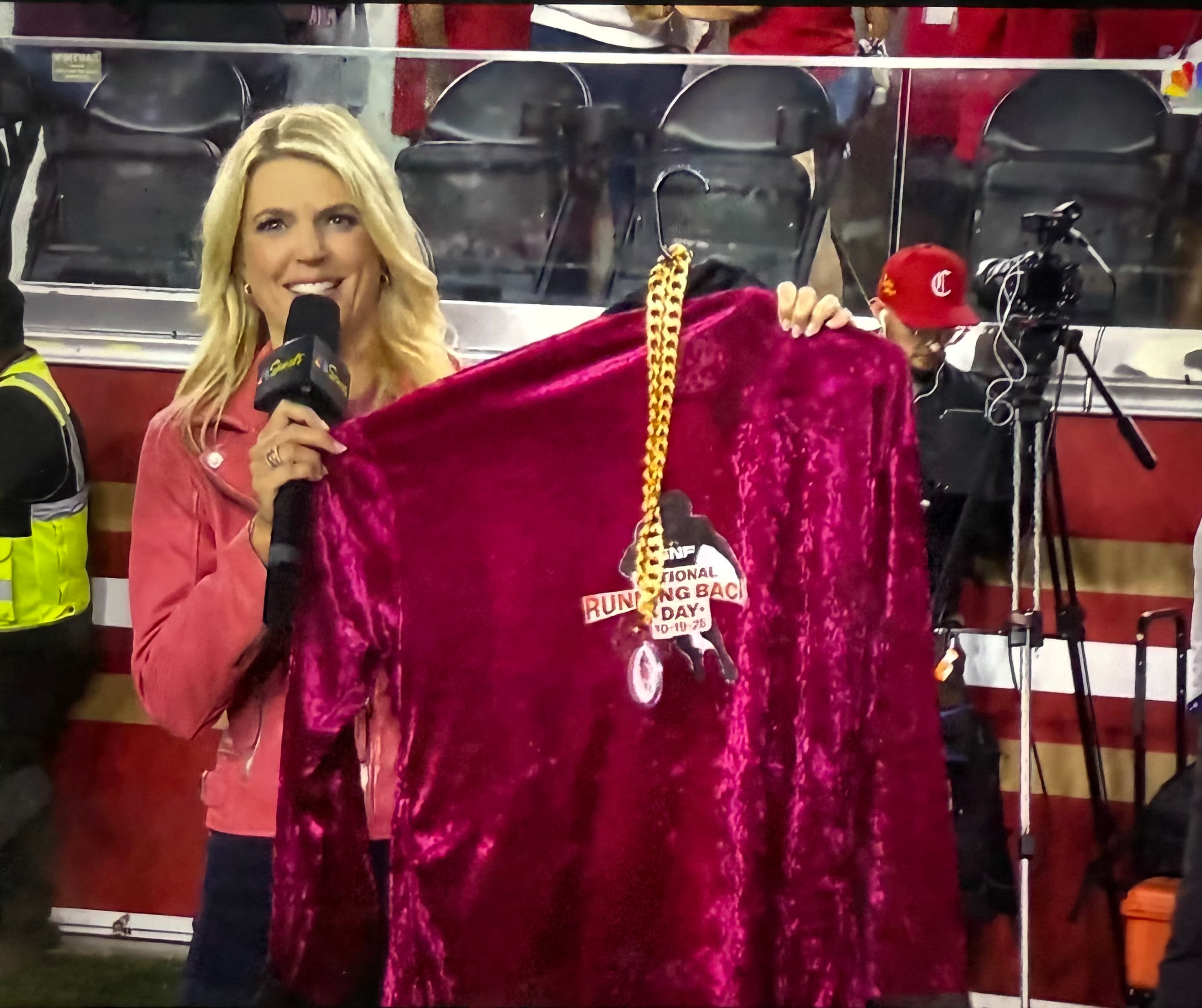 NBC sideline reporter Melissa Stark shows off the robe she'd later give three San Francisco 49ers players on Oct. 19, 2025, in honor of "National Running Backs Day." (Courtesy of NBC Sports)